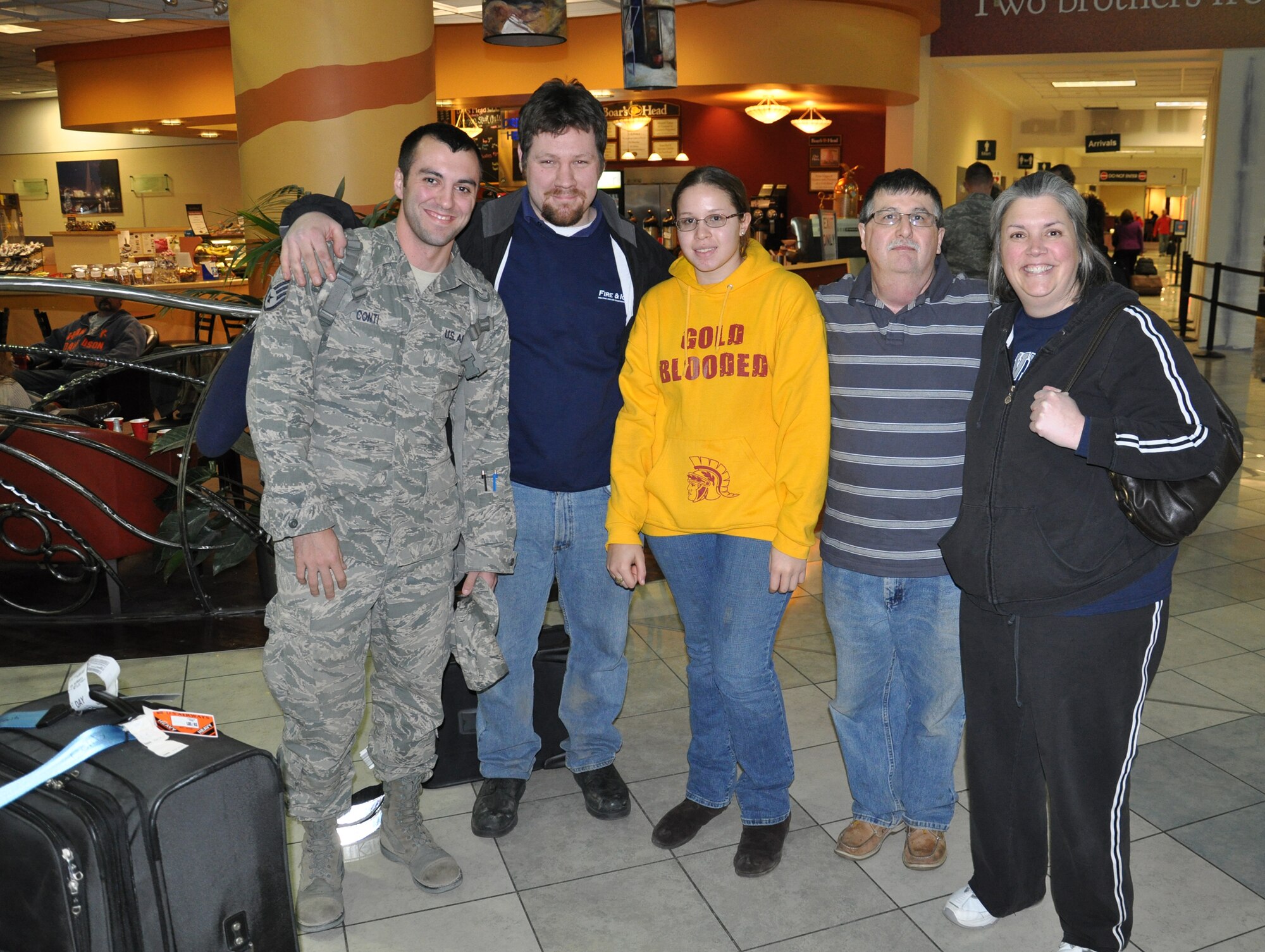 WRIGHT-PATTERSON AIR FORCE BASE, Ohio –Staff Sgt. Andrew Conti, 445th Aeromedical Staging Squadron, is welcomed by family and friends at the Dayton International Airport Jan. 5. Sergeant Conti just returned from a 179-day deployment to Joint Base Balad, Iraq. (U.S. Air Force photo/Senior Airman Mikhail Berlin)