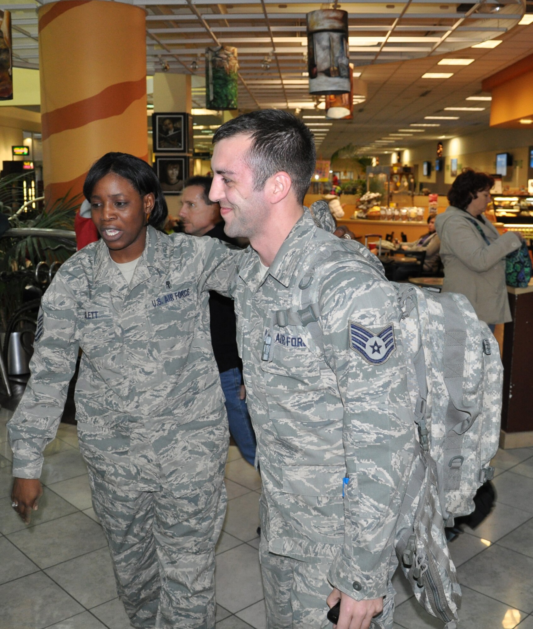 WRIGHT-PATTERSON AIR FORCE BASE, Ohio – Master Sgt. Chirron Hayslett, 445th Aeromedical Staging Squadron, welcomes Staff Sgt. Andrew Conti, 445th Aeromedical Staging Squadron, home from his 179-day deployment to Joint Base Balad, Iraq, after arriving at the Dayton International Airport Jan. 5. (U.S. Air Force photo/Senior Airman Mikhail Berlin)