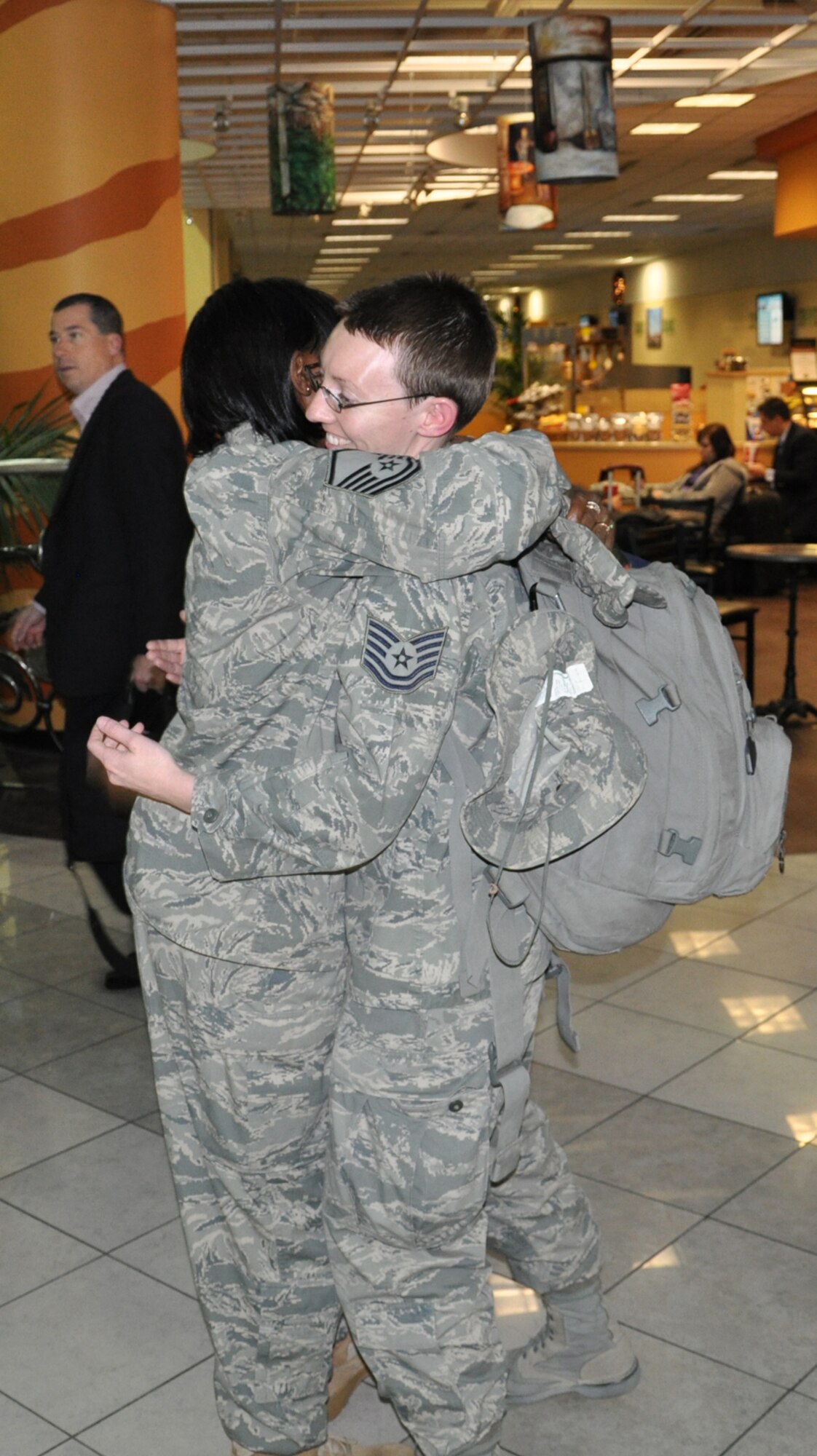 WRIGHT-PATTERSON AIR FORCE BASE, Ohio – Master Sgt. Chirron Hayslett, 445th Aeromedical Staging Squadron, hugs Tech. Sgt. Angela Robertson, 445th Aeromedical Staging Squadron, at the Dayton International Airport Jan. 5. Sergeant Robertson just returned from a 179-day deployment to Joint Base Balad, Iraq. (U.S. Air Force photo/Senior Airman Mikhail Berlin)