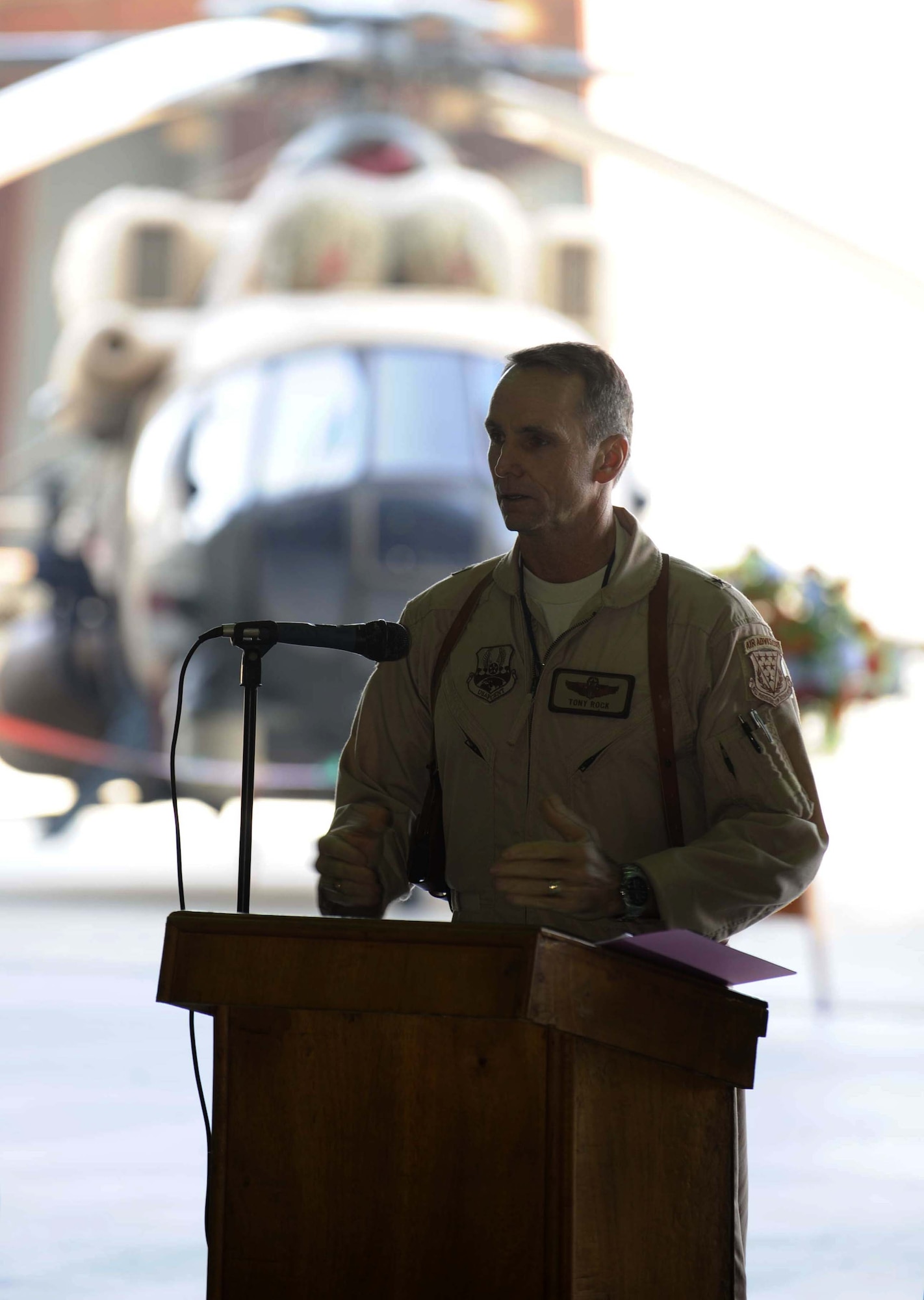 Brig. Gen. Anthony Rock, 321st Air Expeditionary Wing commander, and Iraq Training and Advisory Mission director, addresses the crowd at the ribbon-cutting ceremony in Taji Jan. 17.  The massive aircraft hangar is a $9.8 million project that began in 2009. (US Air Force Photo by TSgt Randy Redman, released)