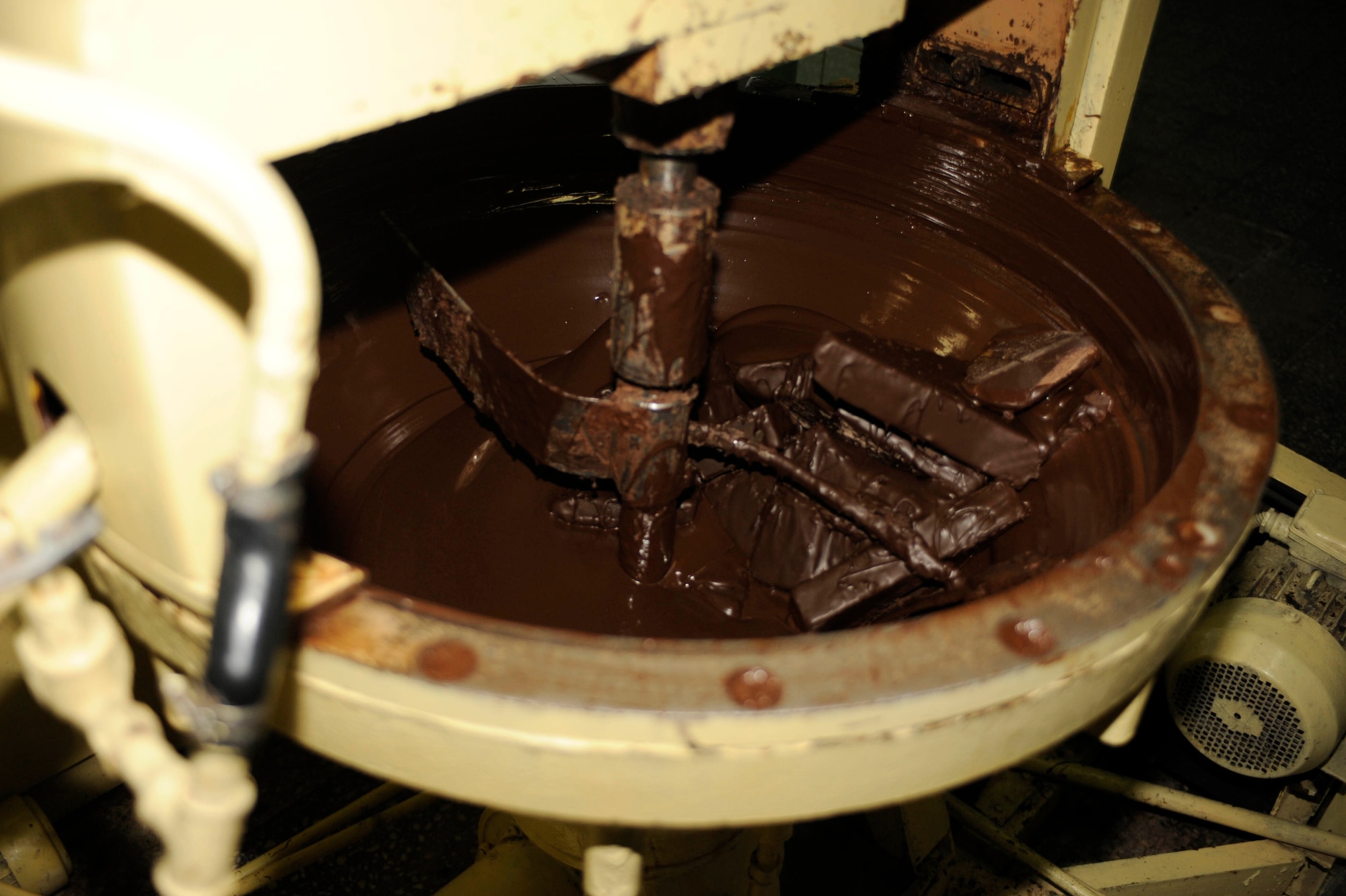 BISHKEK, Kyrgyzstan -- a machine preps chocolate before its layered onto cookies.  Transit Center at Manas officials are looking at expanding the dining facility menu to include locally manufactured goods.  (U.S. Air Force photo/Tech. Sgt. Jerome C. Baysmore) 
