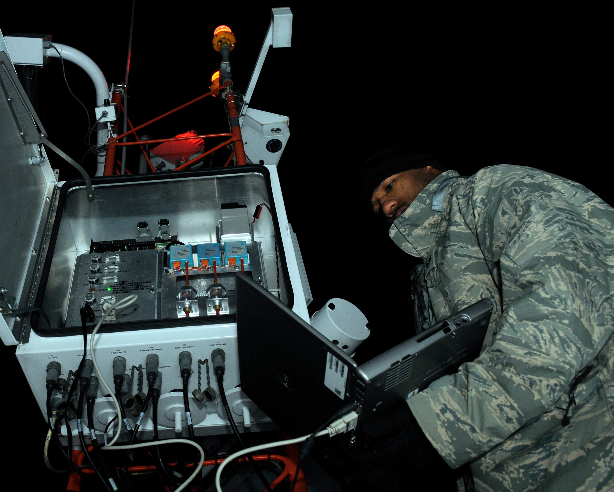 U.S. Air Force Senior Airman Kai Hall, 35th Communications Squadron airfield systems technician, interfaces with the FQ 19 weather system to run a diagnostic test Jan. 20, 2011, Misawa Air Base, Japan. The weather system that AS Airmen maintain is capable of measuring cloud height, air temperature, presence of freezing rain and a myriad of other possible weather conditions.  (U.S. Air Force photo by Tech. Sgt. Phillip Butterfield/Released)