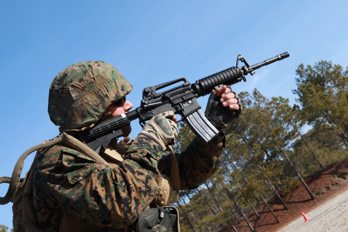 Gunnery Sgt. Chad R. Kiehl, the combat camera chief with the 24th Marine Expeditionary Unit, fires his rifle during a day of combat marksmanship training at range K406B on Camp Lejeune, N.C. Jan. 20. The 24th MEU conducted the training to sustain the combat marksmanship skills of the Marines and Sailors within the Command Element.