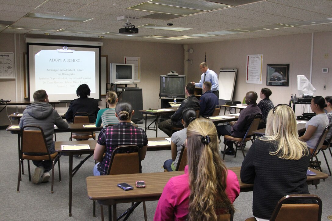 Volunteers from Marine Wing Support Squadron 374 and Marine Unmanned Aerial Vehicle Squadrons 1 and 3 receive a class on how to properly tutor and mentor students from the Assistant Superintendent of Instructional Services of the Morongo Unified School District Jan. 21, 2011. Volunteers will help tutor students at local junior high schools.