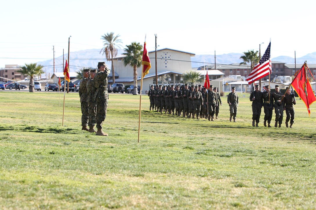 Both Sgt. Maj. Michael A. Miller and Sgt. Maj. Wiliam P. Toves salute the Marines and sailors along with their commanding officer at the end of the Marine Unmanned Aerial Vehicle Squadron 1 relief and appointment ceremony Jan. 21, 2011, at Lance Cpl. Torrey L. Gray Field.