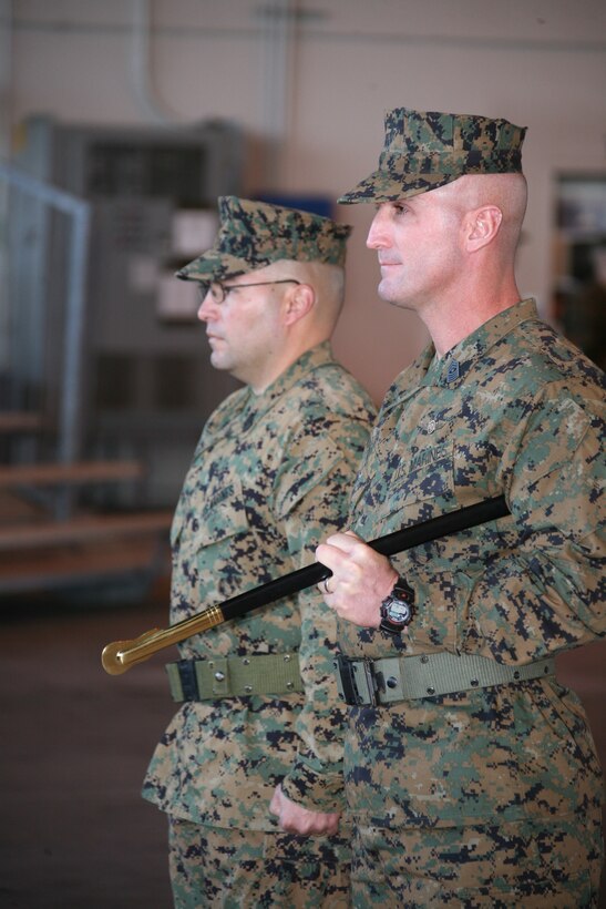 Sgts. Maj. William O. Mayo, right, and Robert P. Palechek, left, stand ready for the transfer of the sword during the 2nd Low Altitude Air Defense Battalion relief and appointment ceremony held at Marine Aerial Refueler Transport Squadron 252’s hangar Jan. 21. Mayo relinquished his post as the sergeant major of 2nd LAAD to Palechek during the ceremony.