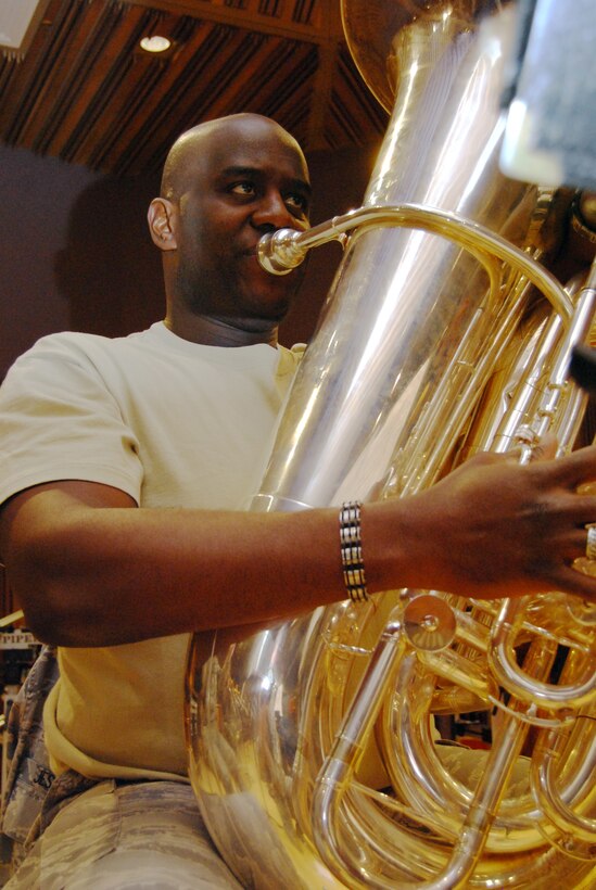 Tech. Sgt. Emanuel Jester III performs part of the second movement of "Opening New Doors" in the Air Force Academy Band's recording studio at Peterson Air Force Base, Colo., Jan. 21, 2010. Sergeant Jester, a native of Orlando, Fla., is a tubist with the Academy's concert and marching bands and the Stellar Brass ensemble. (U.S. Air Force photo/Staff Sgt. Don Branum)