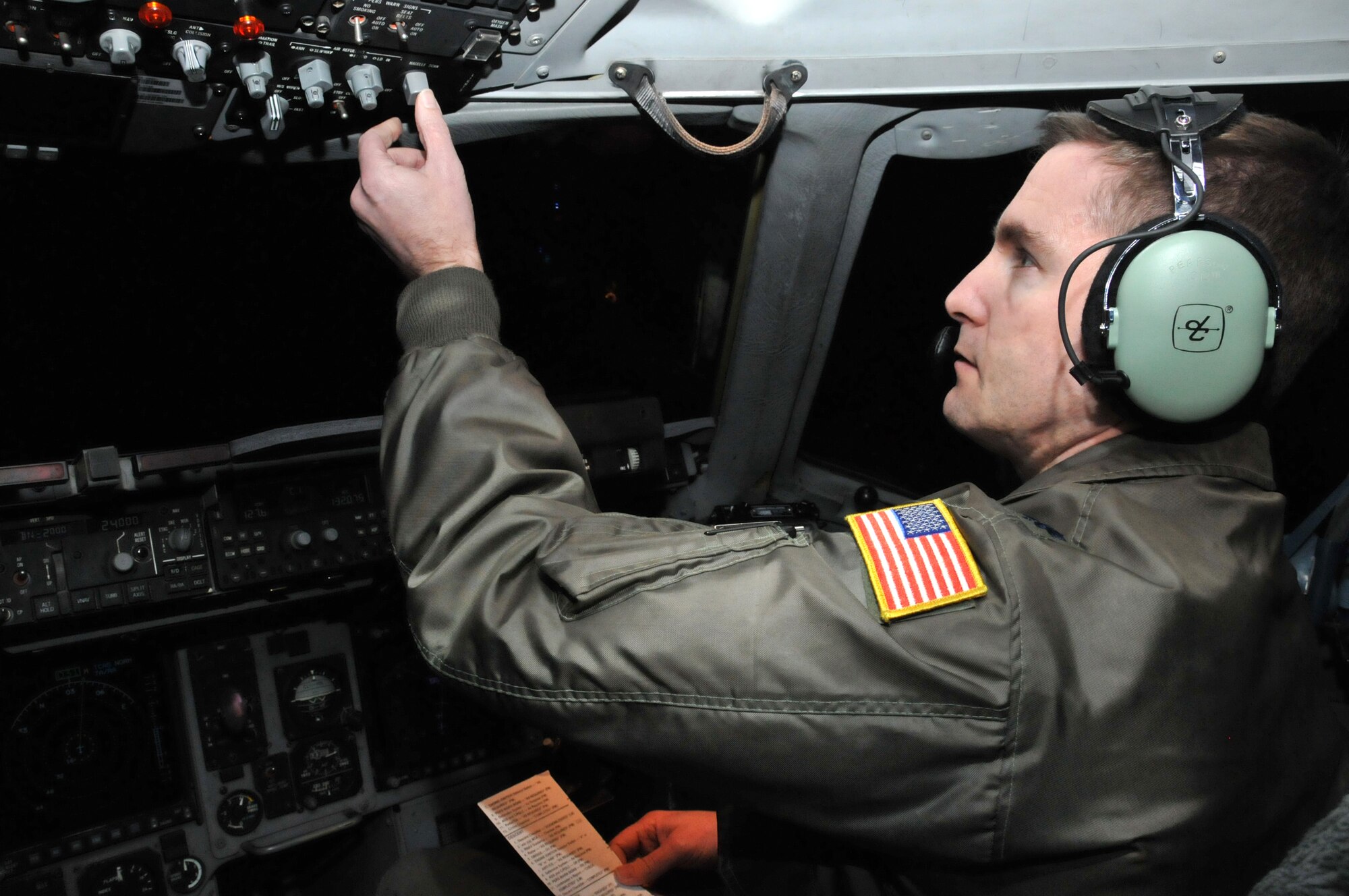MCCHORD FIELD, Wash.- Lt. Col. Paul Pearson, a Reserve evaluator pilot with the 313th Airlift Squadron, prepares for landing here during a training mission returning from Joint Base Pearl Harbor-Hickam, Jan. 11. Colonel Pearson needed an overseas landing to stay current on his training. (U.S. Air Force photo/Master Sgt. Jake Chappelle)