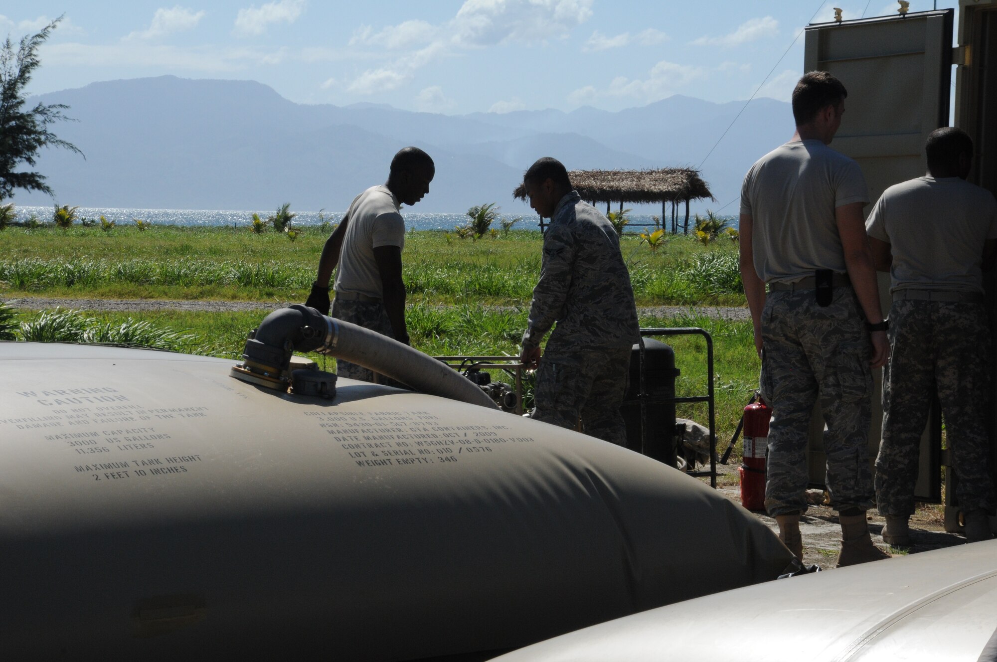 SOTO CANO AIR BASE, Honduras -- Joint Task Force-Bravo petroleum, oil and lubricant teams from 1-228th Aviation Regiment and Army Forces here train together at a forward area refuel point in Puerta Castilla. JTF-B suppports U.S. interests in Central America through humanitarian assistance and disaster relief efforts, counter-illicit trafficking operations and multi-national joint training exercises. (U.S. Air Force photo/Staff Sgt. Kimberly Rae Moore)