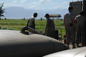 SOTO CANO AIR BASE, Honduras -- Joint Task Force-Bravo petroleum, oil and lubricant teams from 1-228th Aviation Regiment and Army Forces here train together at a forward area refuel point in Puerta Castilla. JTF-B suppports U.S. interests in Central America through humanitarian assistance and disaster relief efforts, counter-illicit trafficking operations and multi-national joint training exercises. (U.S. Air Force photo/Staff Sgt. Kimberly Rae Moore)
