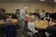 Lieutenant Col. Michael Husfelt, center, 627th Air Base Group wing chaplain, speaks with a group of builds relationships at the weekly Women’s Bible Study and Fellowship Jan. 20 at the McChord Field Chapel Support Center, Joint Base Lewis-McChord, Wash. (U.S. Air Force photo/Airman Leah Young)