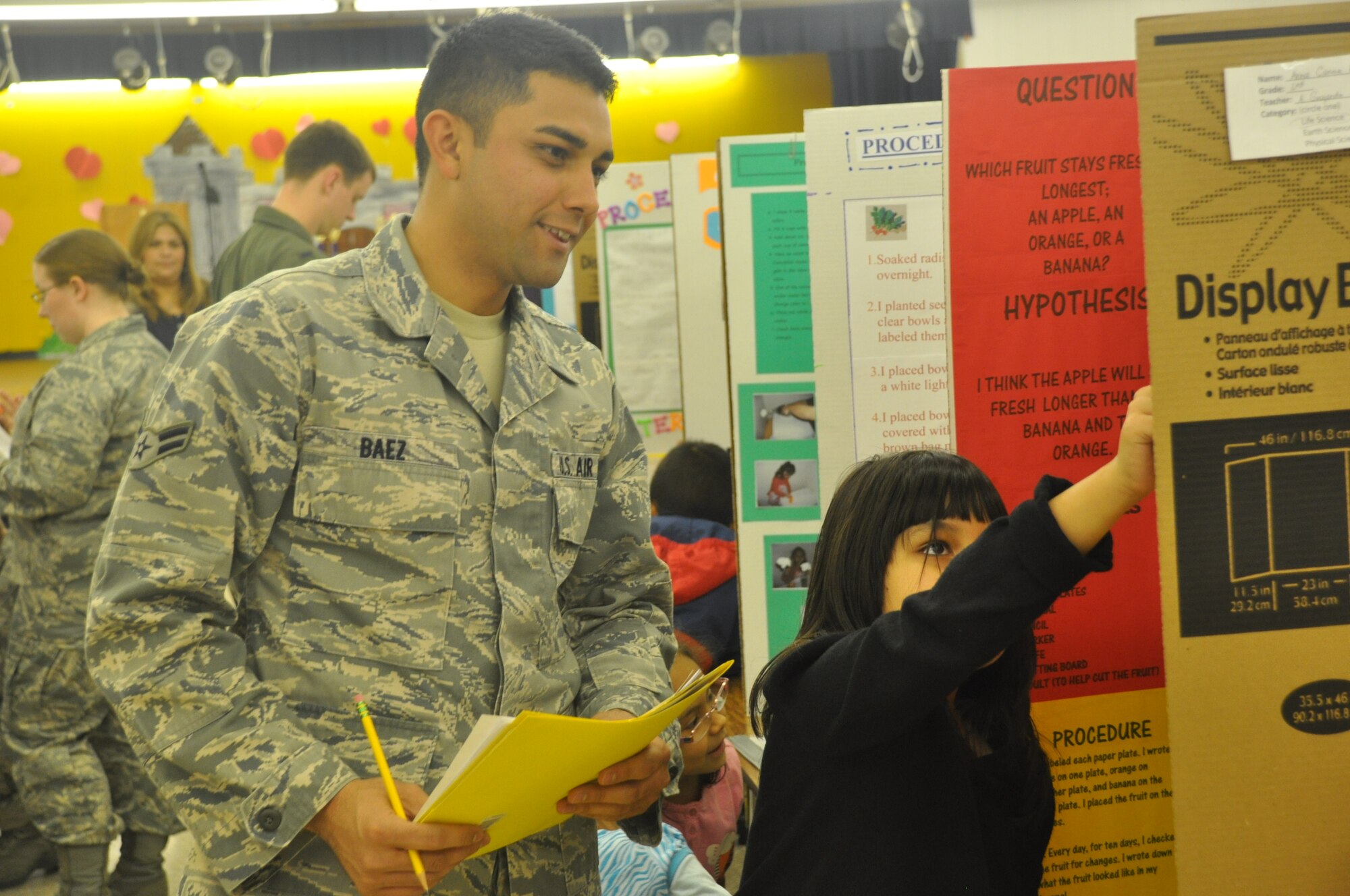 LAUGHLIN AIR FORCE BASE, Texas – Airman 1st Class Justin Baez, 47th Operations Support Squadron, judges a Lamar Elementary student’s science fair project in Del Rio Jan. 19. Winners from science fairs such as this one will compete at the San Felipe Del Rio Consolidated Independent School District science fair Feb. 3 at the Del Rio Civic Center. (U.S. Air Force photo by 2nd Lt. Ashley Wolfe)