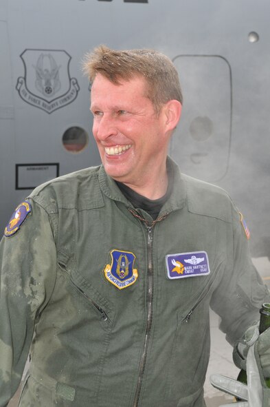 Chief Master Sgt. Mark Hartnett, 96th Airlift Squadron flight engineer, is splashed down in sub zero temperatures after his final flight. Chief Harnett is retiring after 33 years of Service.  (Air Force Photo/Tech. Sgt. Bob Sommer)
