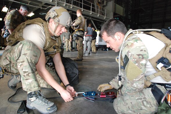 CAPE CANAVERAL AIR FORCE STATION, Fla. - Senior Airman Eric Humphrey, reserve pararescueman from Davis-Monthan Air Force Base, Ariz., and Master Sgt. Joe Traska, reserve pararescueman with the 920th Rescue Wing, Cocoa Beach, Fla., prepare their ropes and pulleys for rescue training. The training, by ROCO Rescue, is high-angle, high-altitude and confined space rescue refresher for the PJs and combat rescue officers.   (U.S. Air Force photo/Staff Sgt. Leslie Kraushaar)