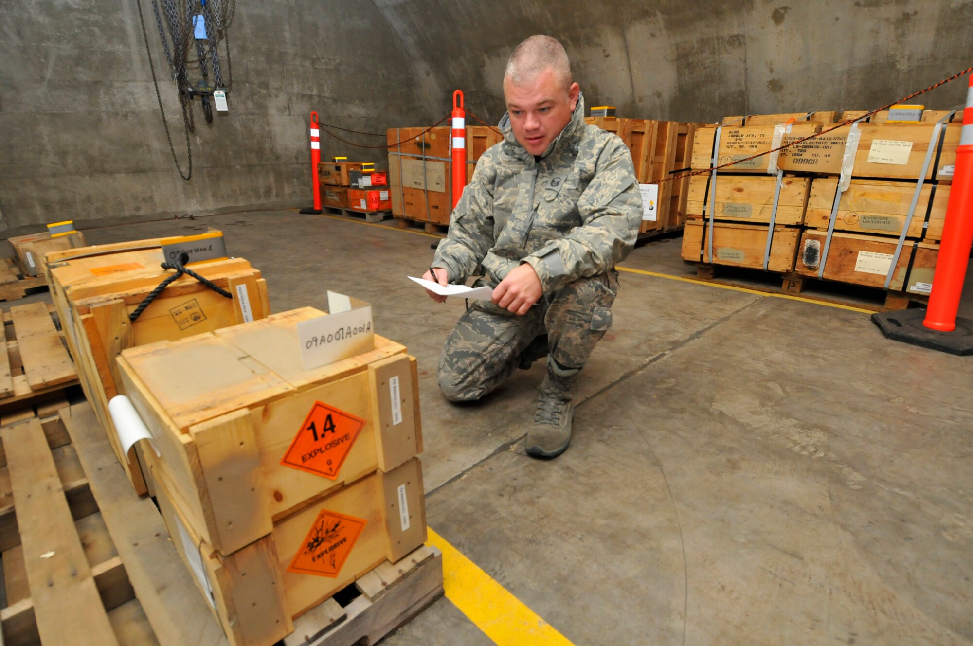 Master Sgt. Ryan Miller, AEDC’s munitions accountable systems officer, conducts an inventory on base munitions stored in a blast resistant, reinforced area on the base. The munitions at Arnold are for base defense and a number of research, development and testing projects. Sergeant Miller and his five-member team are responsible for the safe procurement, transportation, storage, use and dispensing of a broad array of hazardous materials on base. These include aviation fuel, heavy and light oils, explosives and munitions, and ozone depleting substances. During his off duty time, Sergeant Miller has started his own ministry with the aim of helping others help themselves. One effort he has spearheaded involves helping adults pursue a General Equivalency Diploma and higher education.  (Photo by Rick Goodfriend)