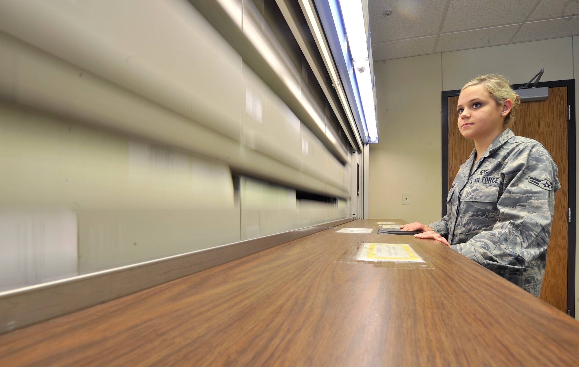 Airman 1st Class Jamie Walden, an aviation resource manager with the 2nd Operations Support Squadron, locates a file using the electriever filing system in the Host Aviation Resource Management office on Barksdale Air Force Base, La., Jan. 19. The electriever is an electronic filing device making it easier to keep track of the 725 aircrew records kept there. The HARM office makes sure all aircrew are physically qualified, keeps track of all flight record folders, logs flight times, awards ratings and badges, gives flight record reviews, publishes aeronautical orders and in/out processes all flyers and jumpers on base. (U.S. Air Force photo/Senior Airman Chad Warren)(RELEASED)