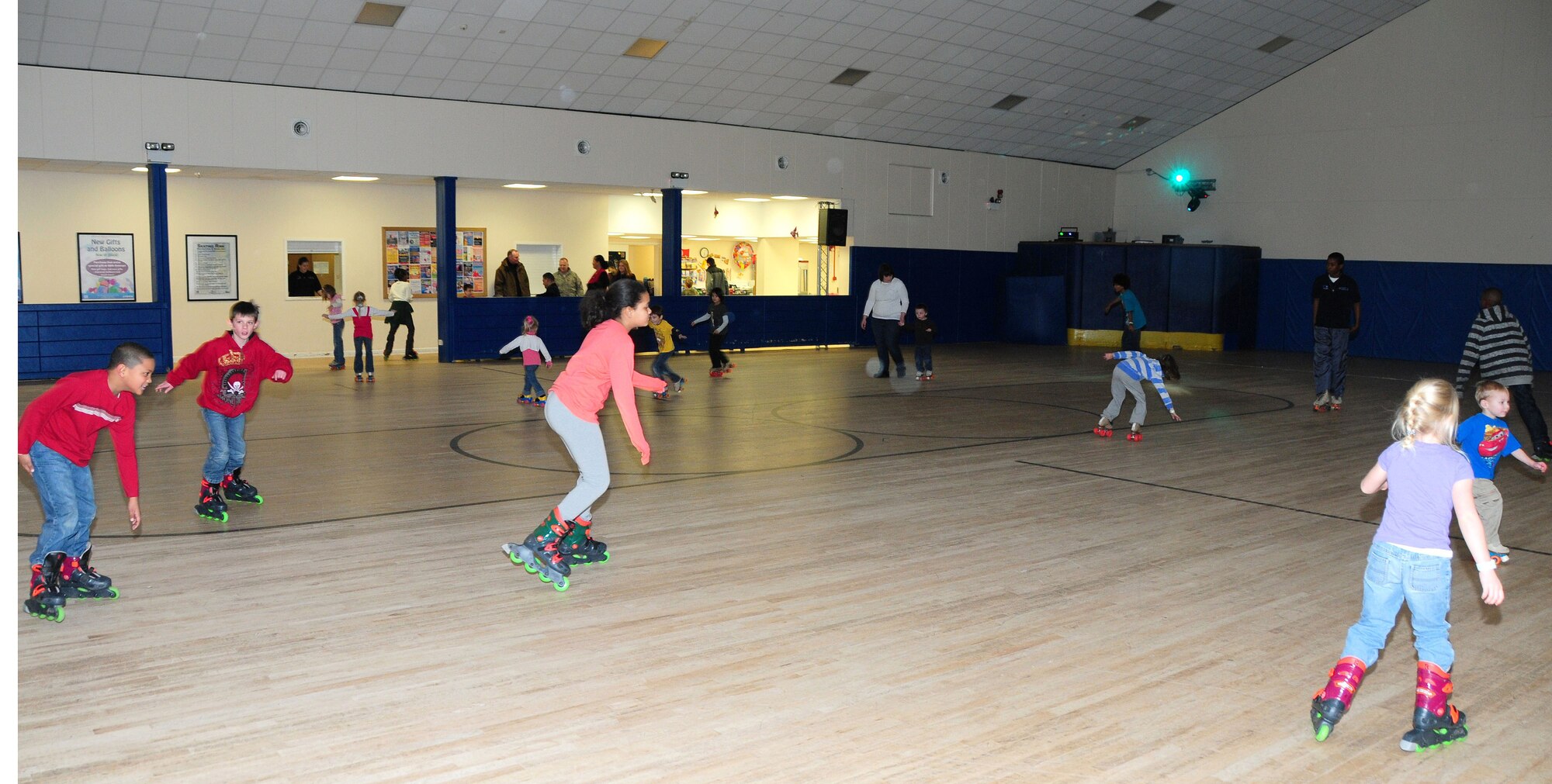ROYAL AIR FORCE LAKENHEATH, England -- Family members enjoy a night out at the skating rink during the Deployed Family Member Social, Jan. 19. The Airman and Family Readiness Center hosted this special event for the spouses and children quarterly to support families while their loved ones are deployed. Each social is sponsored by different organizations on base. The Community Action Information Board and Integrated Delivery System co-sponsored for this quarter. The social is held each quarter for families with deployed members. (U.S. Air Force photo/Staff Sergeant Connor Estes)

