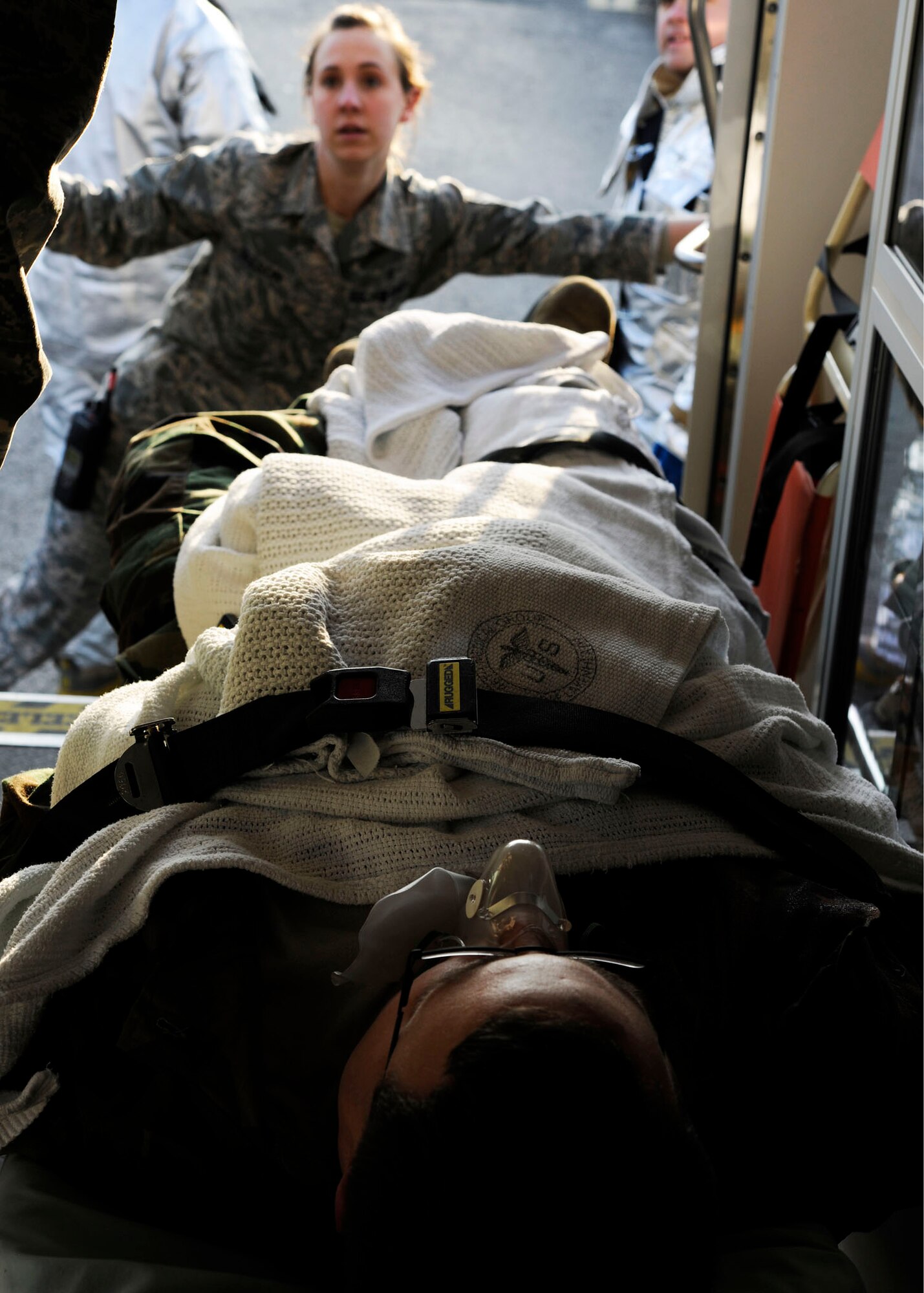 ROYAL AIR FORCE LAKENHEATH, England - Staff Sgt. Caroline Nelson, 48th Medical Operations Squadron emergency room medical technician, closes the ambulance doors after loading Staff Sgt. Robert Powers, 48th Medical Logistics Squadron medical contingency response program manager during a wing level exercise at the Lakenheath Sports & Fitness Center on Jan. 21. This exercise was implemented to test the reactions and response times of the medical personnel, security forces members, firefighters, people working out at the gym and others. (U.S. Air Force photo/Senior Airman Tiffany M. Deuel)