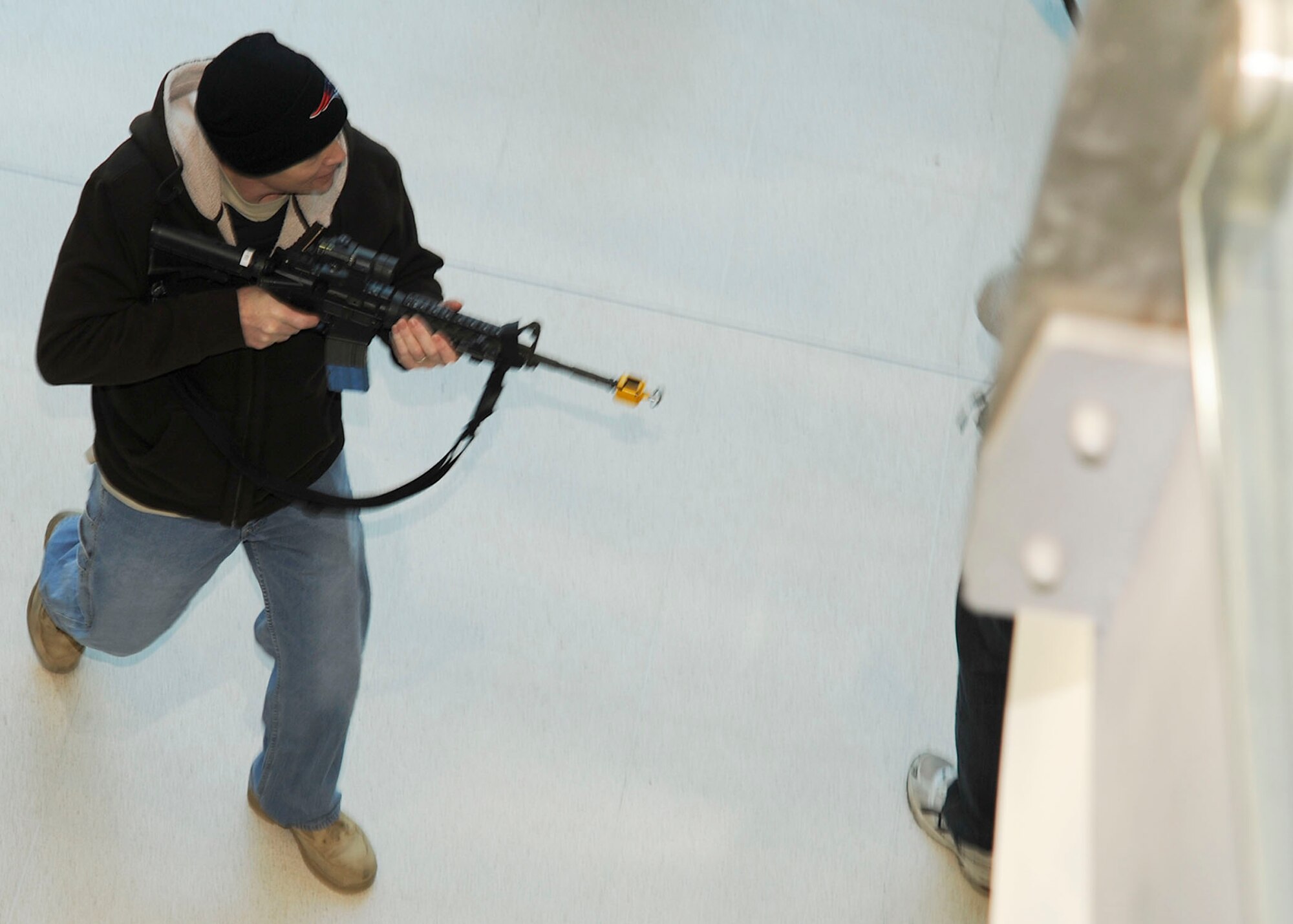 ROYAL AIR FORCE LAKENHEATH, England ? Master Sgt. Joseph Amaral, 48th Fighter Wing NCO in charge of wing inspections, participates in a wing level exercise as an active shooter at the Lakenheath Sports & Fitness Center on Jan. 21. This exercise was implemented to test the reactions and responses of security forces members, medical personnel, firefighters and the people that were working out. (U.S. Air Force photo/Senior Airman Tiffany M. Deuel)