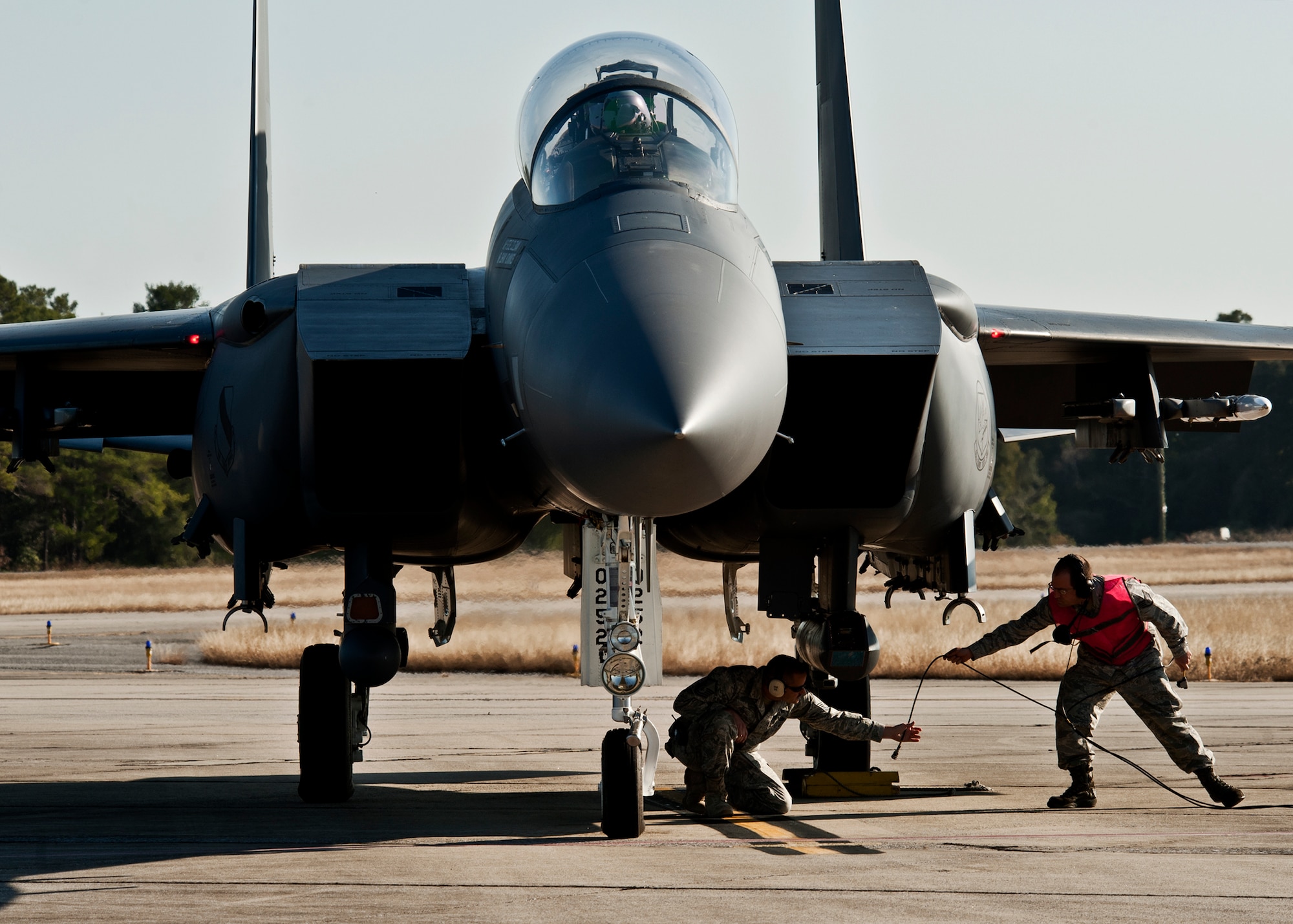 F-15E maintainers from the 46th Maintenance Group perform final checks before takeoff from Eglin Air Force Base Fla., Jan. 18.  The Strike Eagle flew the first ever sortie with the new APG-82 radar.  The new radar replaces the 24-year-old APG-70 radar system.  (U.S. Air Force photo/Samuel King Jr.)