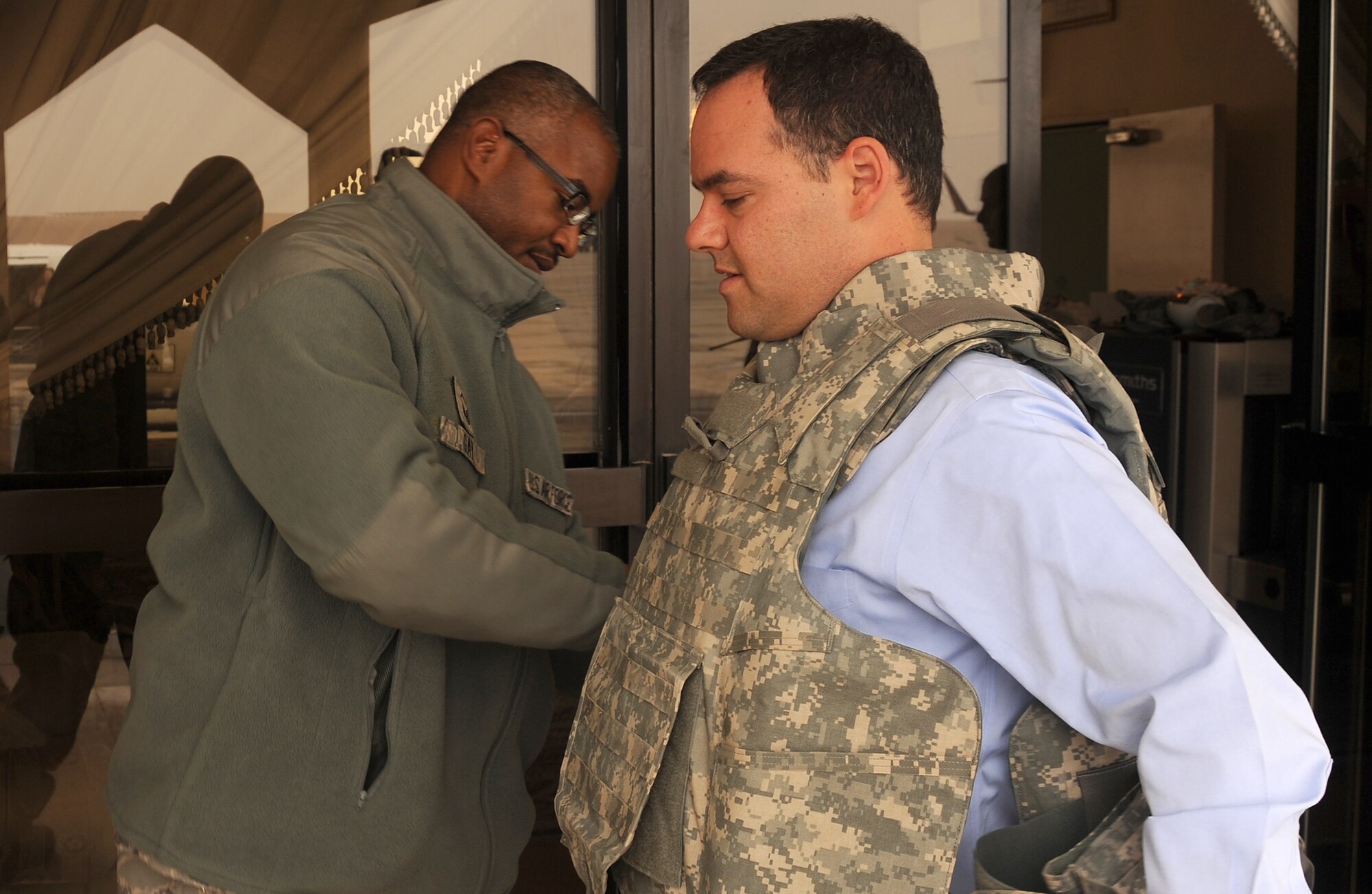 Mr. Daniel B. Ginsberg, Assistant Secretary of the Air Force for Manpower and Reserve Affairs gets fitted for his individual body armor during his visit to Southwest Asia, Jan. 21.  (U.S. Air Force photo/Staff Sergeant Liliana Moreno) (RELEASED)                             