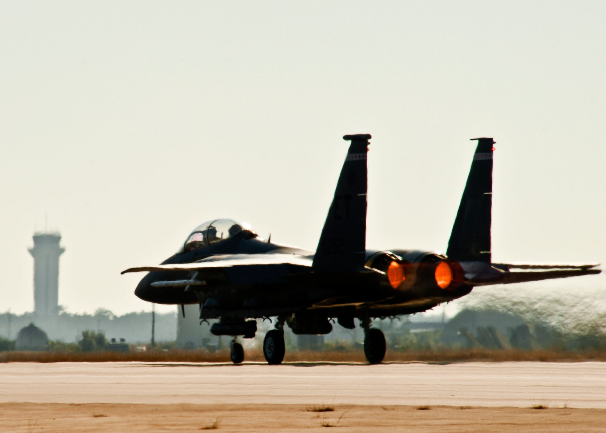 Afterburners burn bright as they move the 46th Test Wing F-15E Strike Eagle down the runway at Eglin Air Force Base, Fla., Jan. 18.  The Strike Eagle flew the first ever sortie with the new APG-82 radar.  The new radar replaces the 24-year-old APG-70 radar system.  (U.S. Air Force photo/Samuel King Jr.)
