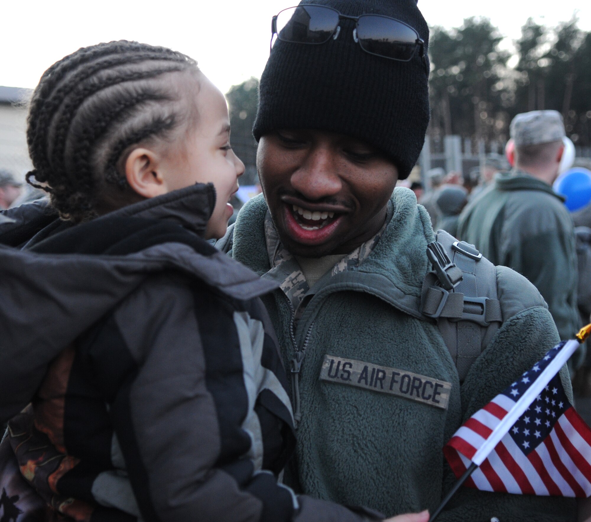 SPANGDAHLEM AIR BASE, Germany – Airman 1st Class Reginald Ward II, 606th Air Control Squadron power production journeyman, holds his son Reginald III after returning home from deployment Jan. 21. Airmen from the 606th ACS returned from bases in Southwest Asia and Kandahar Airfield, Afghanistan. Family members and fellow servicemembers waited to greet the Airmen upon their return here after 6- and 7-month deployments. (U.S. Air Force photo/Airman 1st Class Matthew B. Fredericks)