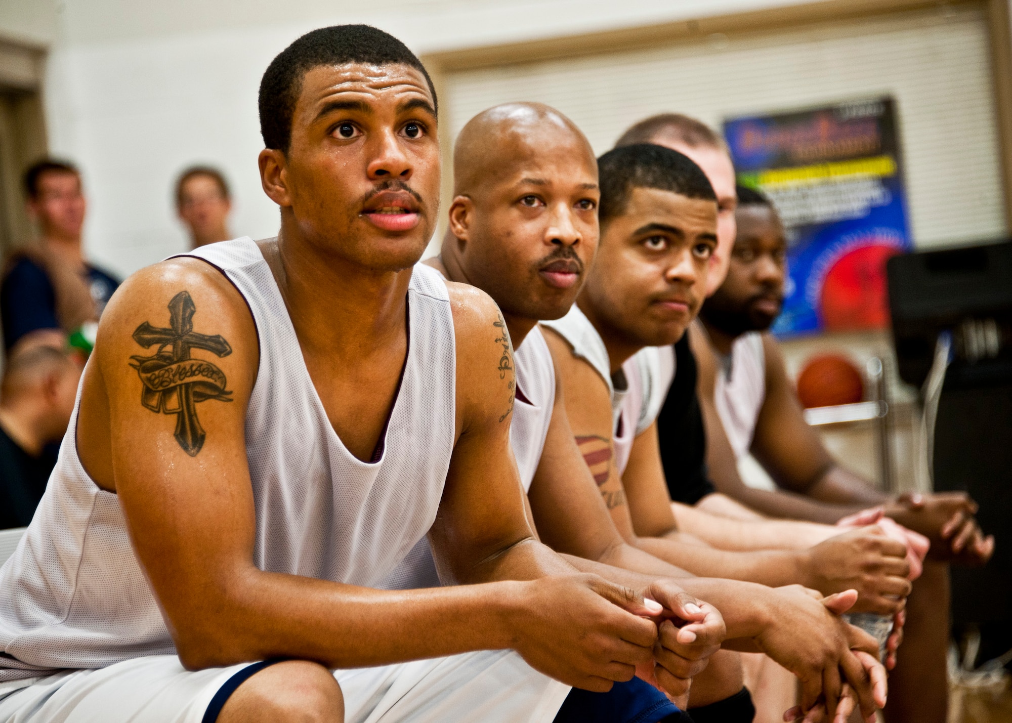 96th Logistics Readiness Squadron team members watch the action from the bench during the during the intramural championship game against the 96th Medical Group Jan. 19 at Eglin Air Force Base, Fla.  LRS defeated MDG, last year’s champs, 64-56 in a double-overtime thriller. (U.S. Air Force photo/Samuel King Jr.)