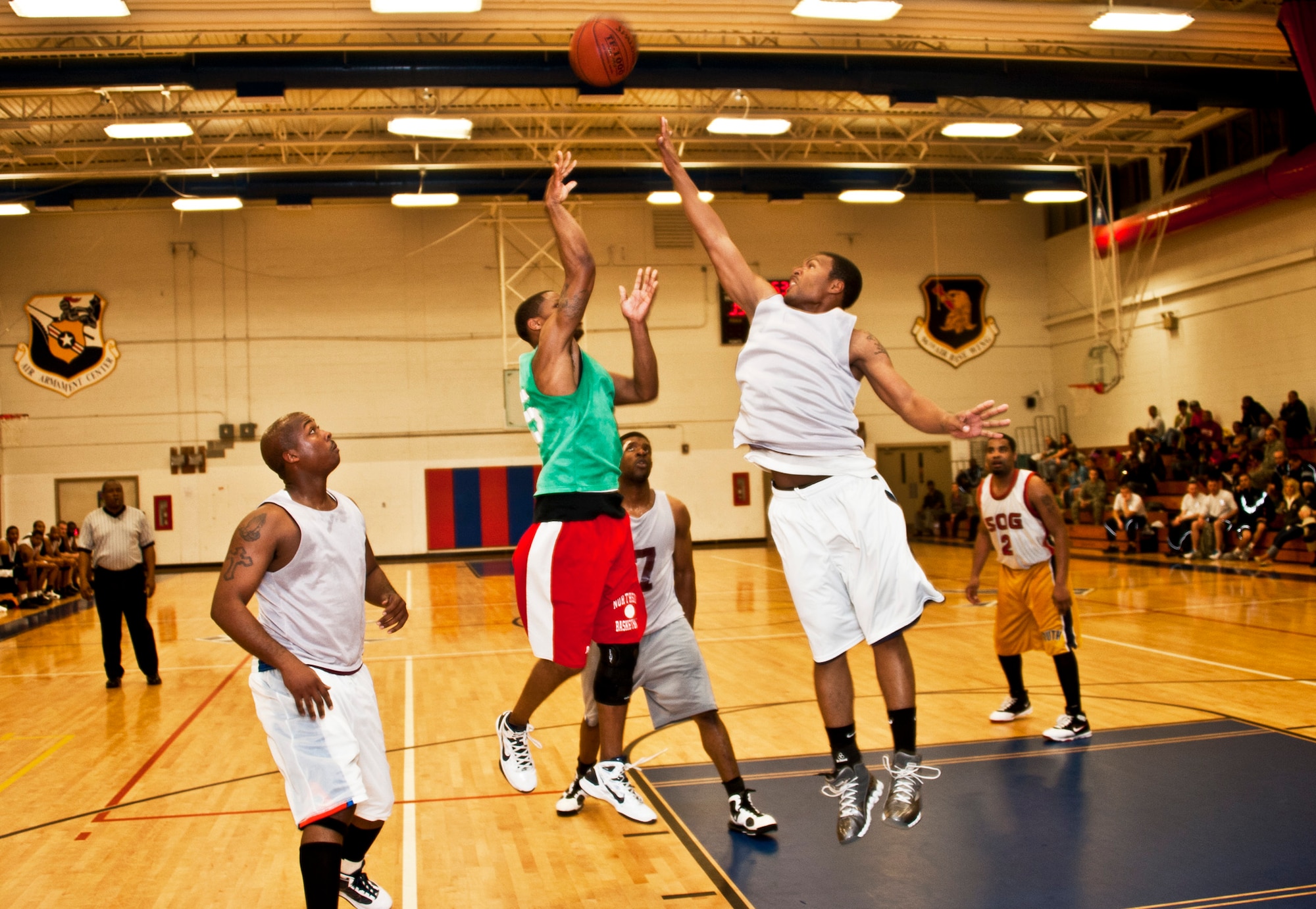 Wendell Thibeaux, 96th Medical Group shoots a jump shot over a 96th Logistics Readiness Squadron defender during the intramural championship game Jan. 19 at Eglin Air Force Base, Fla.  LRS defeated MDG, last year’s champs, 64-56 in a double-overtime thriller. (U.S. Air Force photo/Samuel King Jr.)