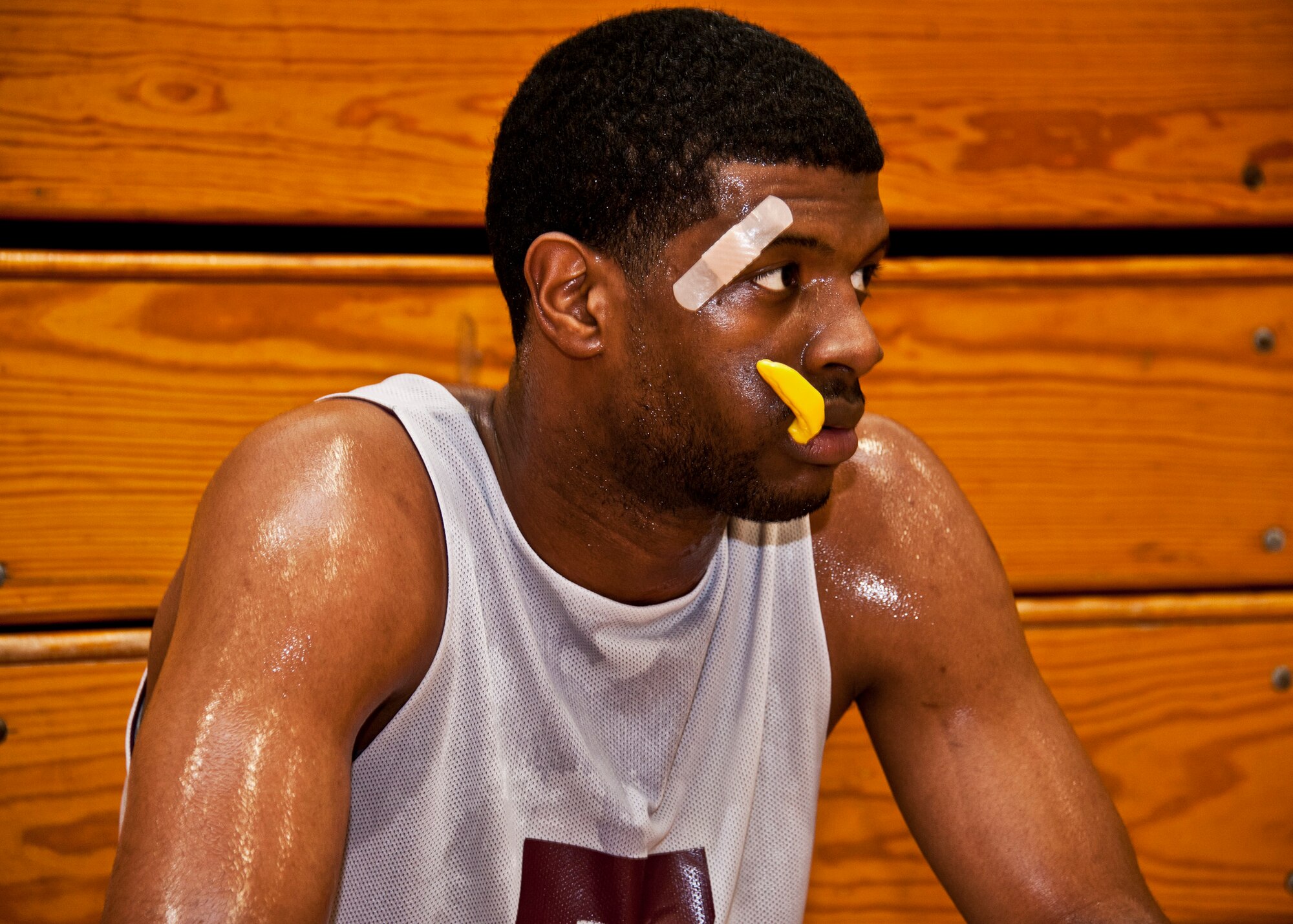 Stanton Simmons, 96th Logistics Readiness Squadron, rests during a time out in the intramural basketball championship against the 96th Medical Group Jan. 19 at Eglin Air Force Base, Fla.  LRS defeated MDG, last year’s champs, 64-56 in a double-overtime thriller.  (U.S. Air Force photo/Samuel King Jr.)  