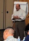 Robert Hamm, Air Education and Training Command Process Improvement Office director, leads a discussion during the Joint Base San Antonio AFSO21 senior leader course Jan. 13. (U.S. Air Force photo/Alan Boedeker)