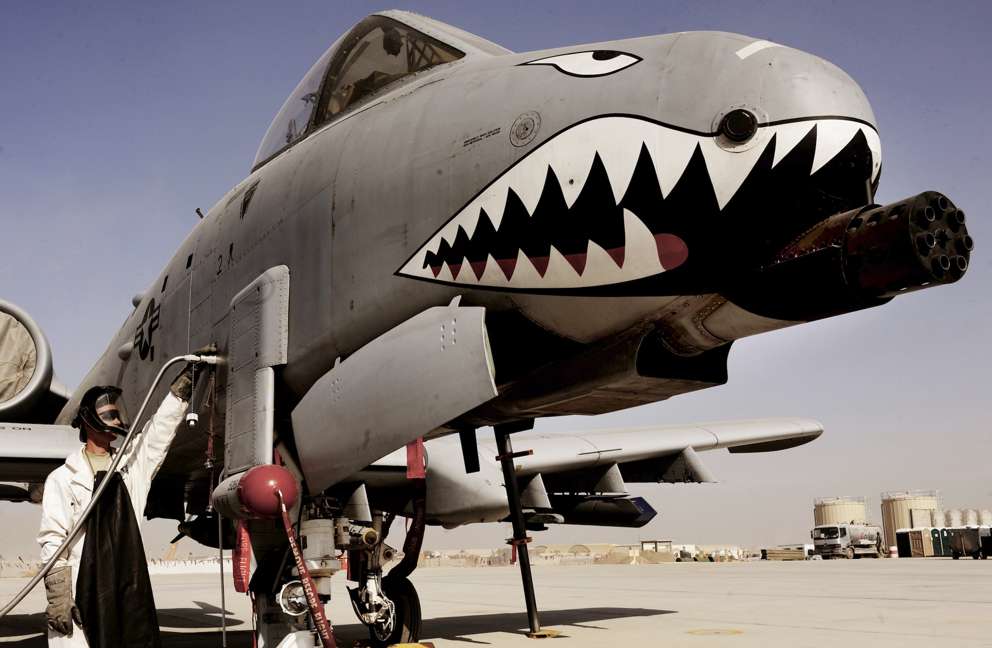 Staff Sgt. Tom Wilson fills an A-10C Thunderbolt II with liquid oxygen, Jan. 11, 2011, at Kandahar Airfield, Afghanistan. The 75th Expeditionary Fighter Squadron recently moved their assets to the other side of the flightline, the first of many moves toward consolidating the 451st Air Expeditionary Wing's missions. Sergeant Wilson is a crew chief assigned to the 451st Expeditionary Aircraft Maintenance Squadron. (U.S. Air Force photo/Senior Airman Willard E. Grande II)