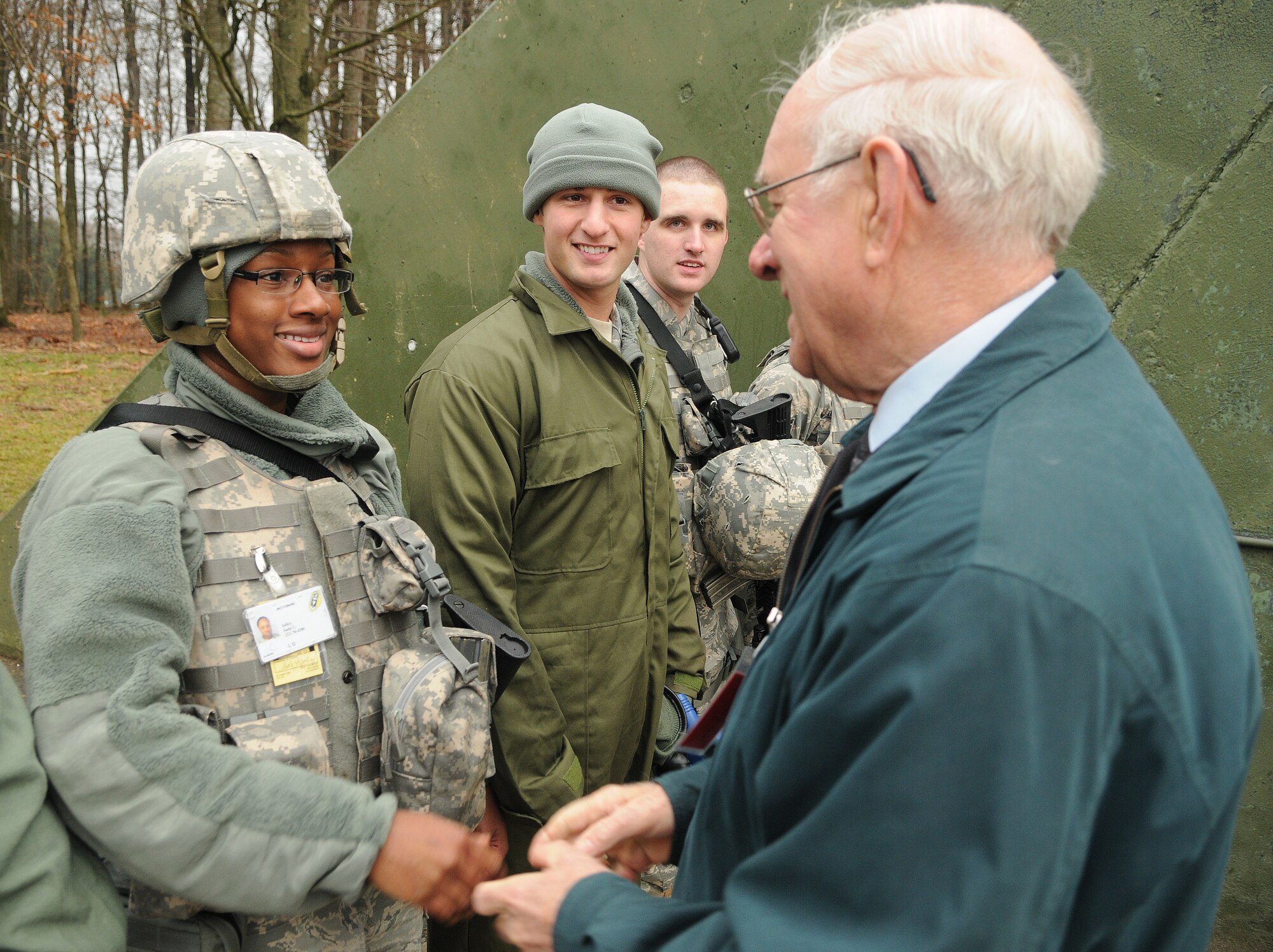 SPANGDAHLEM AIR BASE, Germany – Staff Sgt. Sada Jolley, 702nd Munitions Support Squadron area supervisor, meets retired Chief Master Sgt. of the Air Force Sam Parish after she participated in a joint force recapture and recovery exercise at Beuchel Air Base, Germany, Jan. 18. Chief Parish visited the 52nd Fighter Wing and some of its geographically-separated units to speak about developing and mentoring young Airmen and turning them into the leaders of tomorrow. (U.S. Air Force photo/Senior Airman Nick Wilson)