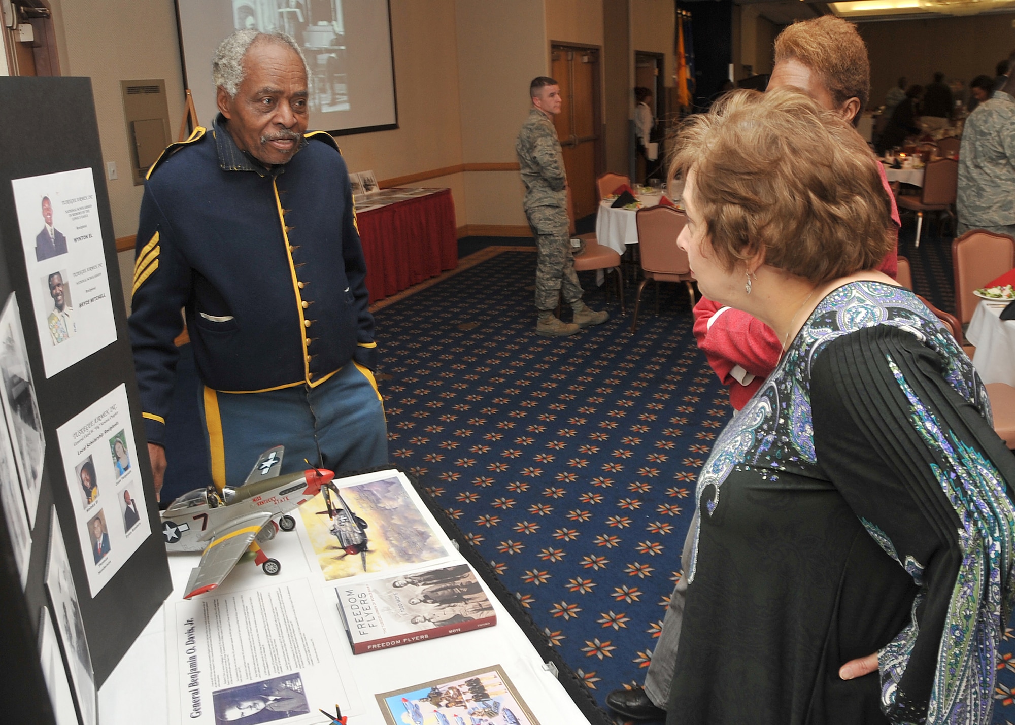 J.T. Fudge, left, answers questions about the Tuskegee Airman during the annual Dr. Martin Luther King Jr. luncheon Jan. 14 at the Mountain View Club.    U.S. Air Force Photo by Todd Berenger.