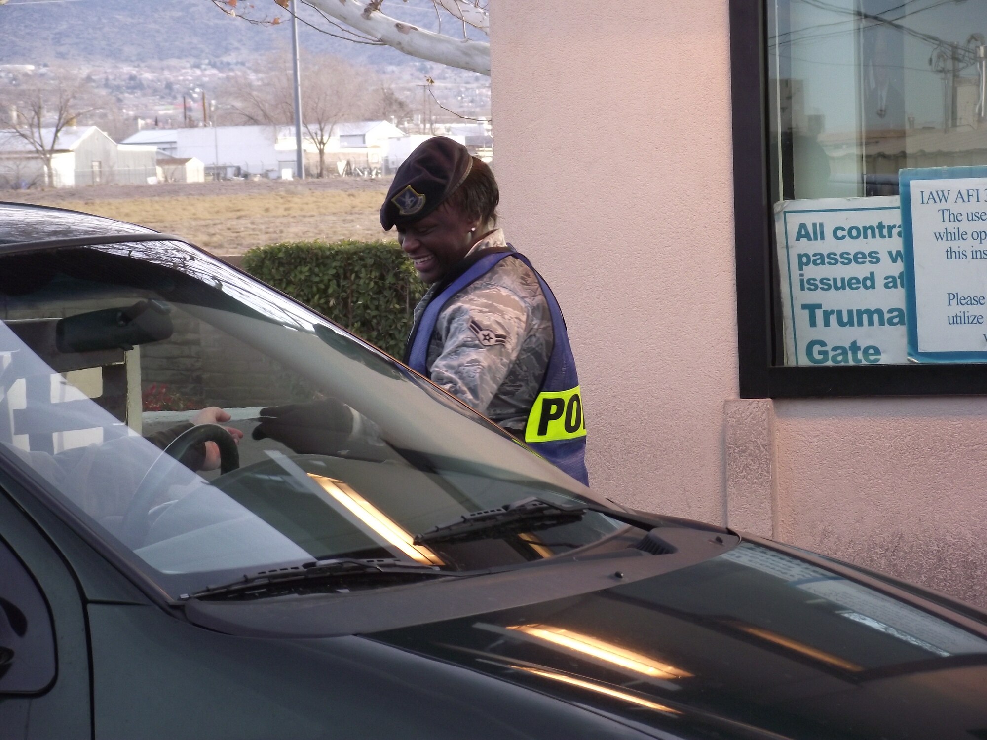 Airman 1st Class Jamileh Wilson, 377th Security Forces Squadron, checks an identification card Jan. 7 at the Wyoming Gate.  U.S. Air Force Photo by Brian Brackens