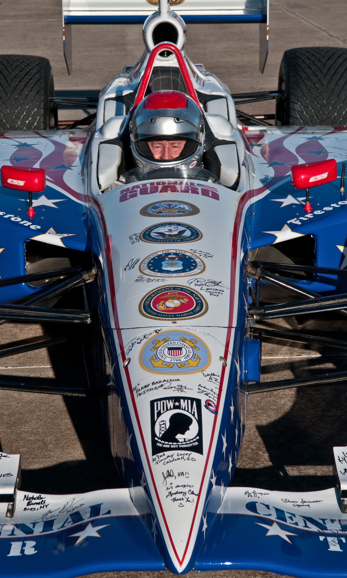 Four-time Indianapolis 500 race winner Mario Andretti , prepares to give a demonstration ride to Airmen during the Indy 500 Centennial Tour Jan. 19, at Incirlik Air Base, Turkey. More than 30 individuals were chosen to ride in the Indy 500 racecar. The Indy 500 Centennial Tour, coordinated by Morale Entertainment Foundation and Armed Forces Entertainment, in conjunction with the IZOD Indy Car Series and the Indianapolis Motor Speedway, is a 10-day morale trip to Europe and the Middle East with the goal of boosting the morale of more than 10,000 servicemembers. The team, which includes Indianapolis 500 winners Mario Andretti, Johnny Rutherford and Al Unser Jr. plus Indy 500 veterans Sarah Fisher, Davey Hamilton, Larry Foyt and Firestone Indy Lights race winner Martin Plowman, spoke with the winners and signed autographs during the visit. (U.S. Air Force photo by Staff Sergeant Alexandre Montes/Released)