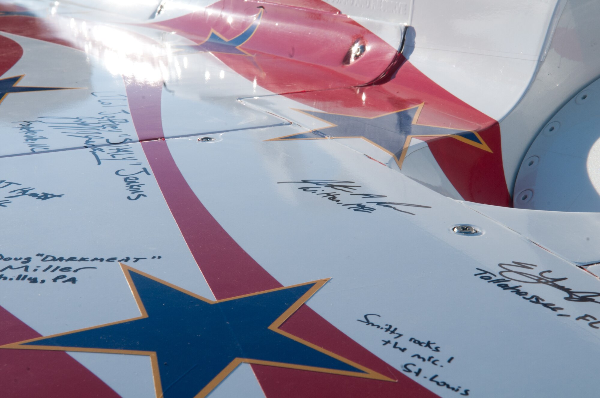 Airmen signed an Indianapolis 500 racecar during a visit from the Indy 500 Centennial Tour team Jan. 19, at Incirlik Air Base, Turkey. More than 30 individuals were chosen to ride in the Indy 500 racecar. The majority of the winners were from a drawing and the rest were selected by their first sergeants. The Indy 500 Centennial Tour, coordinated by Morale Entertainment Foundation and Armed Forces Entertainment, in conjunction with the IZOD Indy Car Series and the Indianapolis Motor Speedway, is a 10-day morale trip to Europe and the Middle East with the goal of boosting the morale of more than 10,000 servicemembers. The team, which includes Indianapolis 500 winners Mario Andretti, Johnny Rutherford and Al Unser Jr. plus Indy 500 veterans Sarah Fisher, Davey Hamilton, Larry Foyt and Firestone Indy Lights race winner Martin Plowman, spoke with the winners and signed autographs during the visit. (U.S. Air Force photo by Staff Sergeant Alexandre Montes/Released)