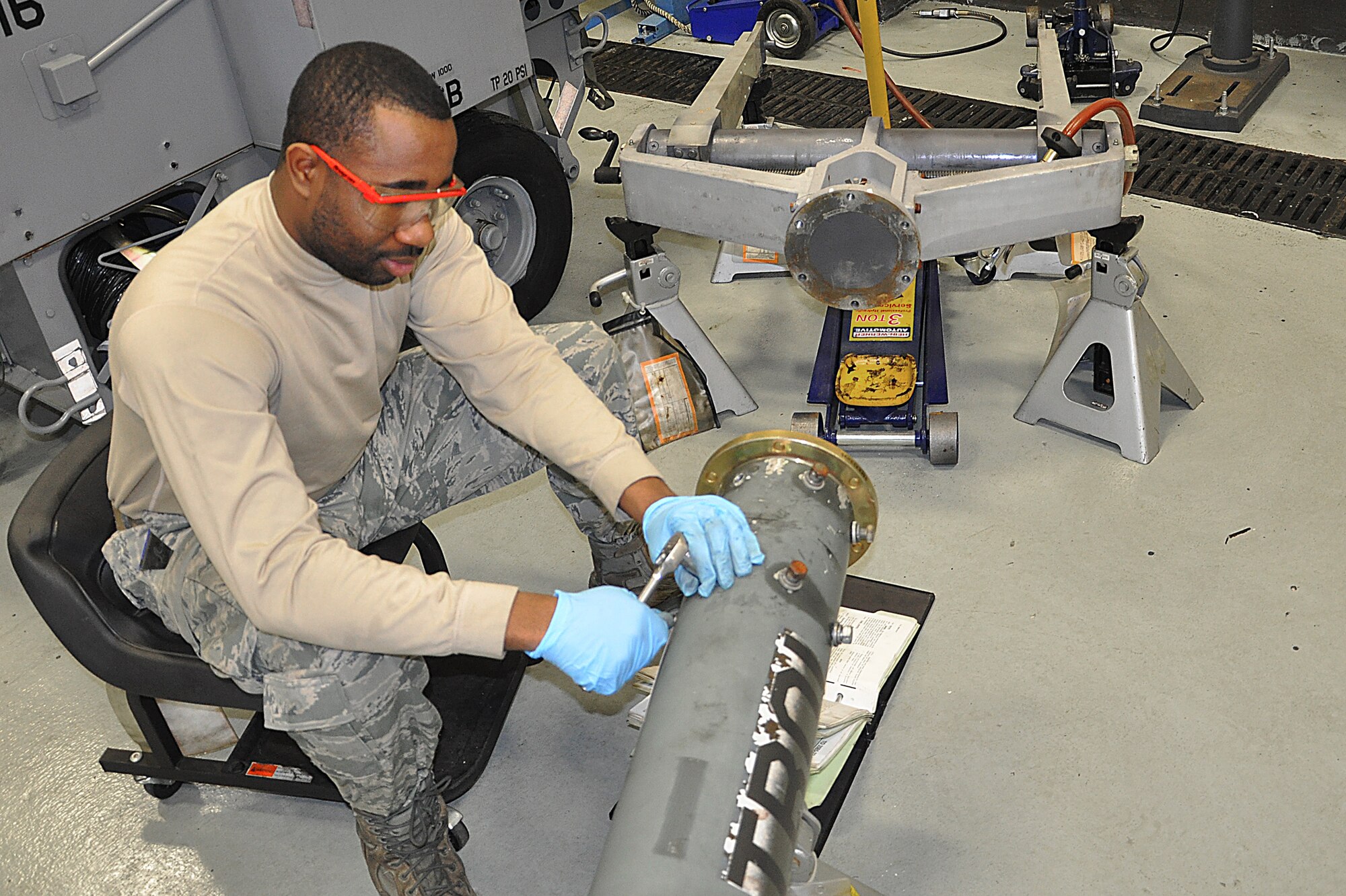 JOINT BASE MCGUIRE-DIX-LAKEHURST, N.J. -- Senior Airman Michael O'Neil, an aerospace ground equipment technician with 514th Maintenance Squadron, repairs a flange on a universal aircraft tow bar here Jan. 20, 2011. The damaged flange was discovered during a scheduled maintenance inspection. The scheduled inspections help to identify and correct potential maintenance problems to ensure the equipment properly operates when used for aircraft maintenance. (U.S. Air Force photo/Tech. Sgt. Shawn J. Jones)