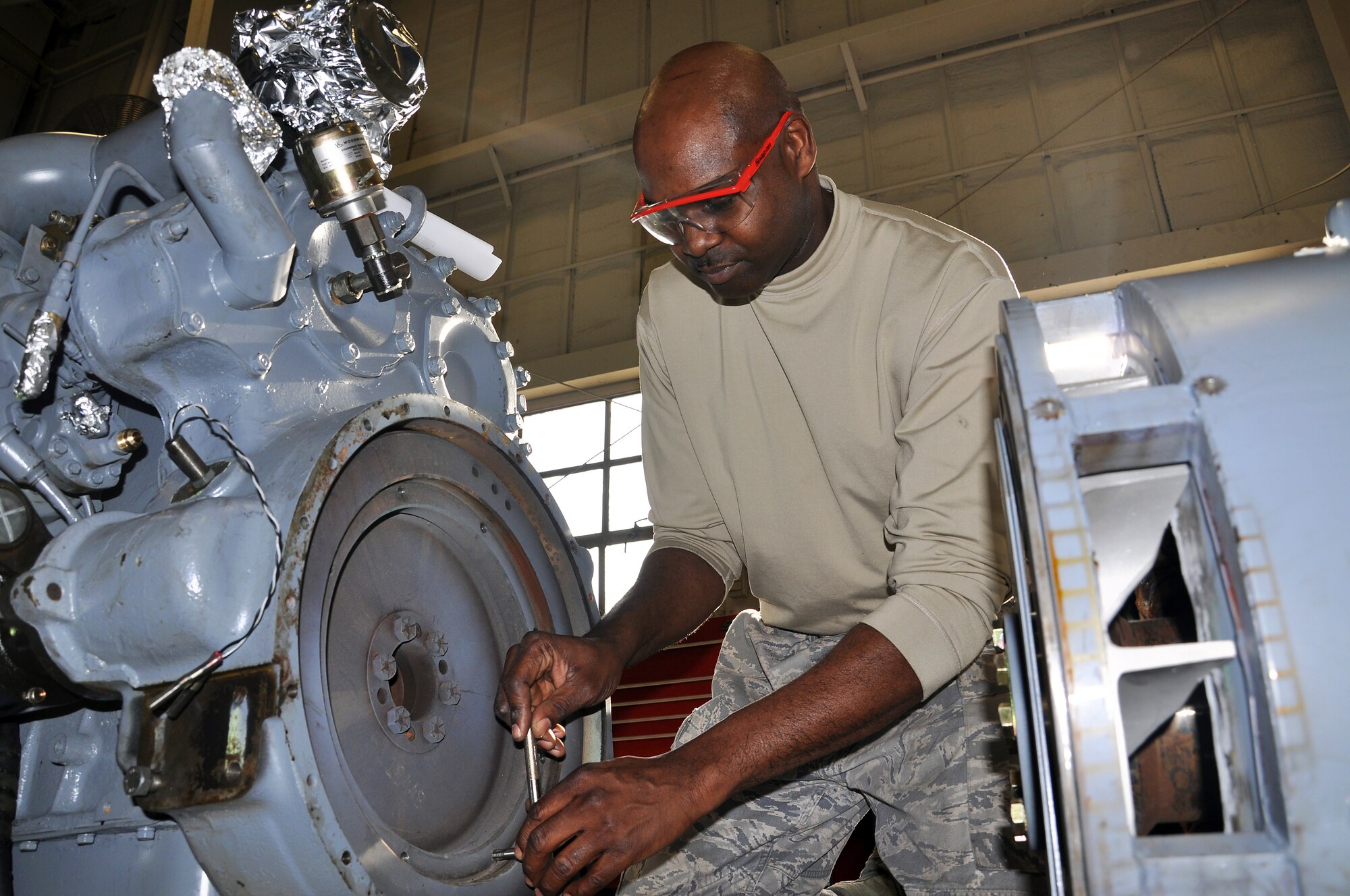 JOINT BASE MCGUIRE-DIX-LAKEHURST, N.J. --Technical Sgt. Spencer Stewart, an aerospace ground equipment technician with 514th Maintenance Squadron, repairs an aircraft ground-power unit here Jan. 20, 2011. The Aerospace Ground Equipment Flight inspects, services and maintains a variety of equipment associated with aircraft maintenance. (U.S. Air Force photo/Tech. Sgt. Shawn J. Jones)