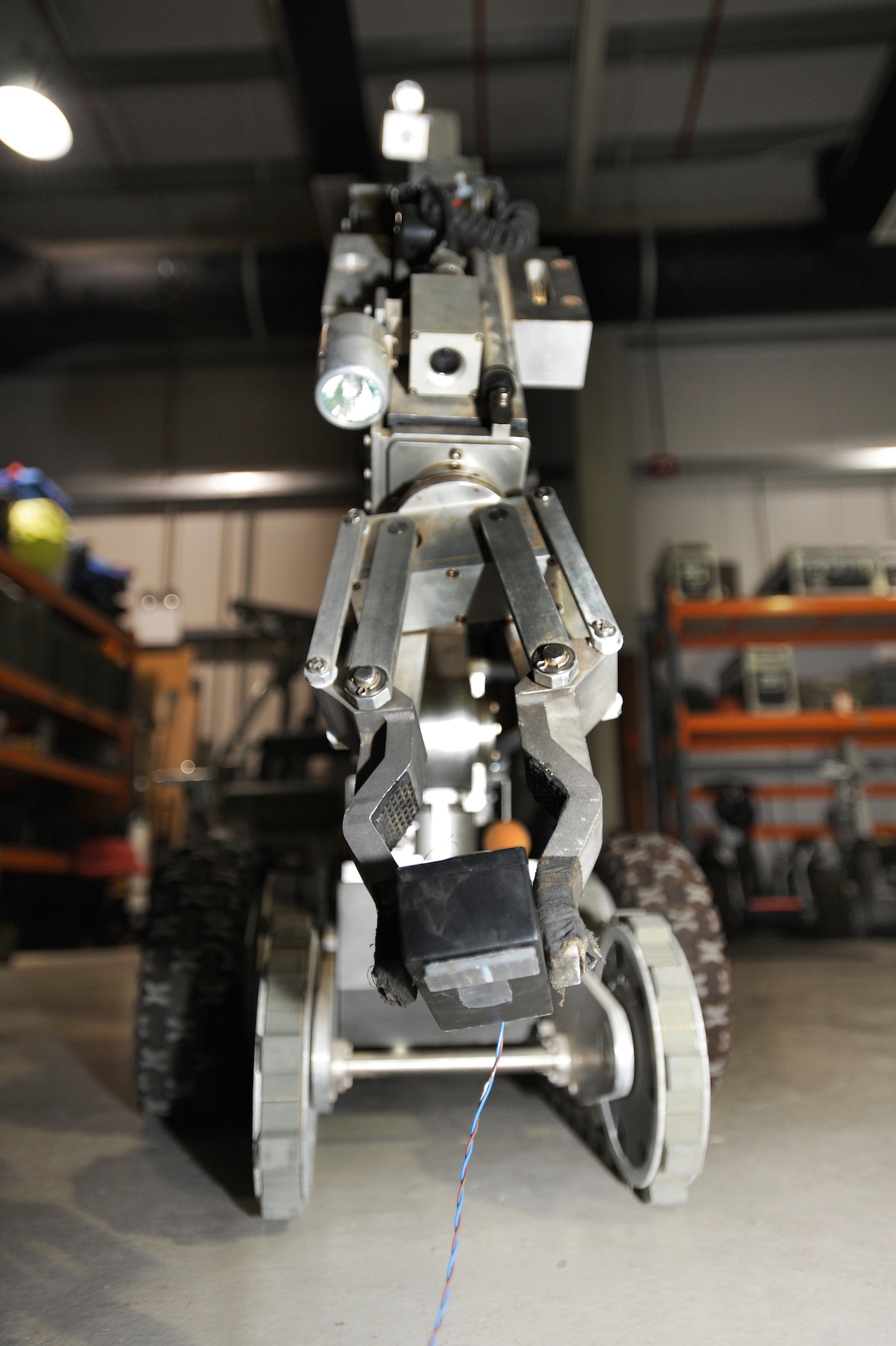 A F6A Home Station Improvised Explosive Device/Weapon of Mass Destruction Response Robot handles a simulated timed explosive Jan 20, 2010 at the Explosive Ordinance Disposal shop. It usually takes about 30 minutes to three hours to completely remove and defuse an explosive, depending on the type. (U.S. Air Force photo by Senior Airman Maynelinne De La Cruz)(Released)