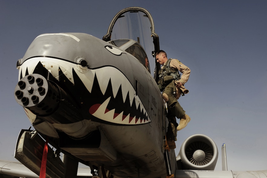 Maj. Loren Coulter exits an A-10C Thunderbolt II, Jan. 11, 2011, at Kandahar Airfield, Afghanistan. The 75th Expeditionary Fighter Squadron recently moved their assets to the other side of the flightline, marking the first of many moves toward consolidating the wing?s missions. Major Coulter is an A-10 pilot assigned to the 75th EFS. (U.S. Air Force photo/Senior Airman Willard E. Grande II)