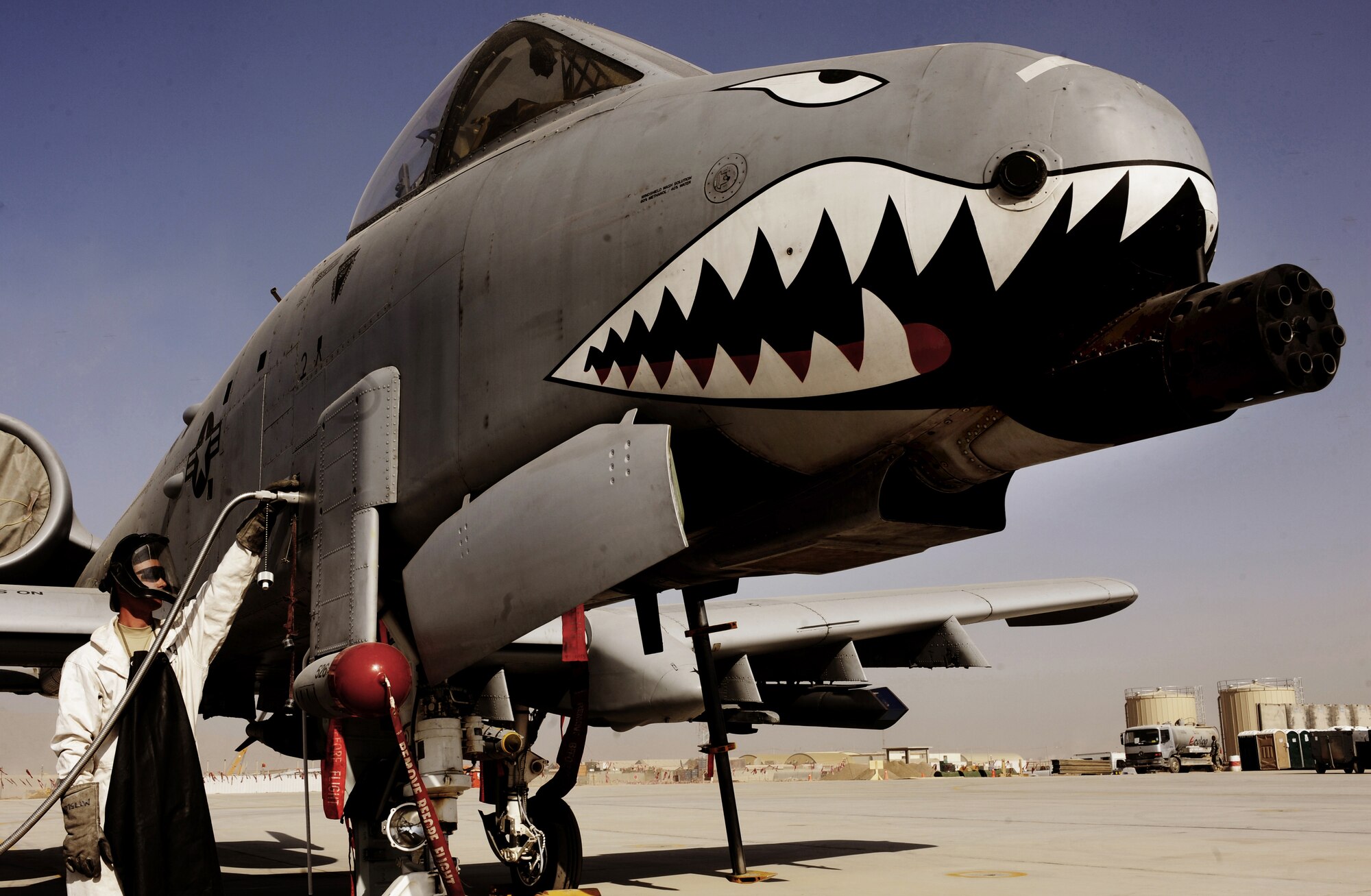 Staff Sgt. Tom Wilson fills an A-10C Thunderbolt II with liquid oxygen, Jan. 11, 2011, at Kandahar Airfield, Afghanistan. The 75th Expeditionary Fighter Squadron recently moved their assets to the other side of the flightline, marking the first of many moves toward consolidating the wing?s missions. Sergeant Wilson is a crew chief assigned to the 451st Expeditionary Aircraft Maintenance Squadron. (U.S. Air Force photo/Senior Airman Willard E. Grande II)
