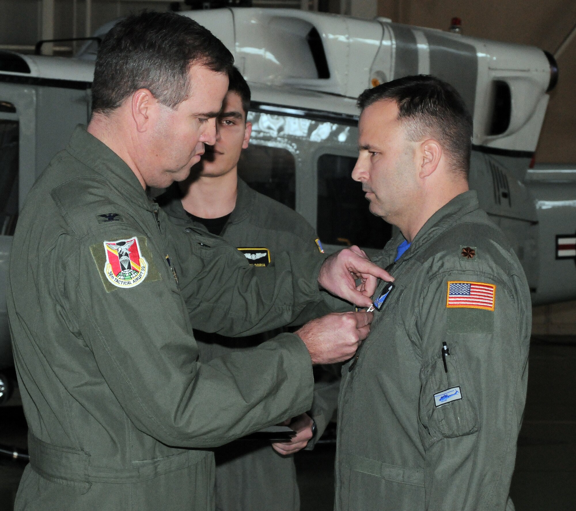 YOKOTA AIR BASE, Japan -- Col. Mark Hering, 374th Operations Group commander, pins a Bronze Star on Maj. Destry Hill, 374th OG assistant director of operations, during a presentation ceremony, here Jan. 14. The Bronze Star Medal is awarded to individuals for acts of heroism or meritorious achievement in ground combat. (U.S. Air Force photo/Airman 1st Class Katrina R. Menchaca)