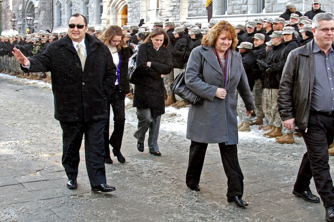 William "Bill" Gallegos, former U.S. Marine Corps guard, waves to with cadets at the U.S. Military Academy at West Point, N.Y., Jan 21, 2011, during the observation of the 30th anniversary of the Iranian hostage crisis of 1979-1980. West Point was the site of their original homecoming in January, 1981. U.S. Army photo by Tommy Gilligan 