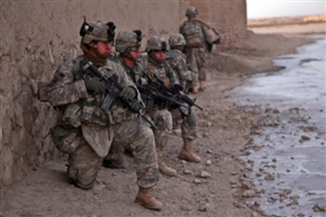 U.S. Army soldiers from the 2nd Stryker Cavalry Regiment provide security during operation Air Wolf in Maiwand district, Kandahar province, Afghanistan, on Jan 5, 2011.  The operation was a joint effort with the Afghan National Army to clear villages of insurgent weapons and improvised explosive device caches.  