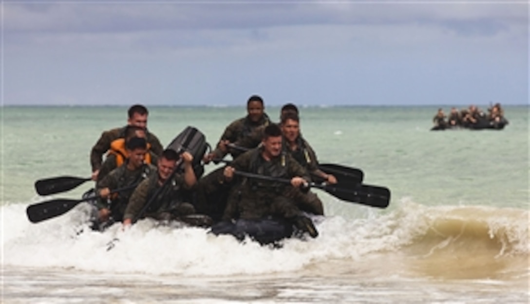 Force reconnaissance Marines with 4th Force Reconnaissance Company paddle toward the beach in F470 Combat Rubber Raiding Crafts during hydrographic reconnaissance training at Marine Corps Training Area Bellows in Waimanalo, Hawaii, on Jan. 13, 2011.  The training was part of a weeklong jump and dive training package that brought the unit, headquartered in Alameda, Calif., together with their Hawaii-based counterparts ó 4th Forcesí 4th Platoon.  