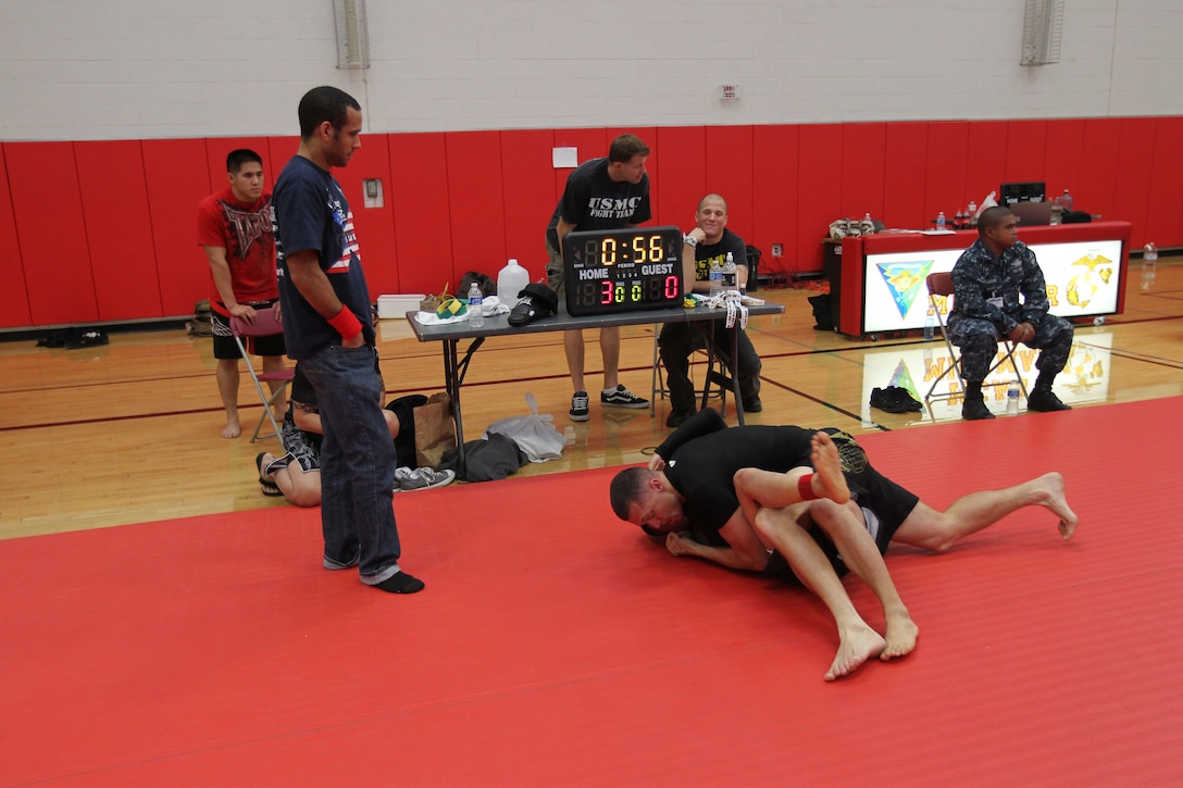 Bill Harrington, a fighter with Fight Club 29, tries to increase his lead during a match at Armed Forces Grapplers Extreme Tournament at Marine Corps Air Station Miramar, Calif., Jan. 22, 2011. Harrington won a silver star for both his weight division and the absolute tournament.