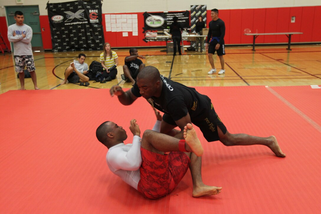 Dominic Waters, a fighter with Fight Club 29, rushes in for a quick victory during an absolute match at Armed Forces Grapplers Extreme Tournament at Marine Corps Air Station Miramar, Calif., Jan. 22, 2011.