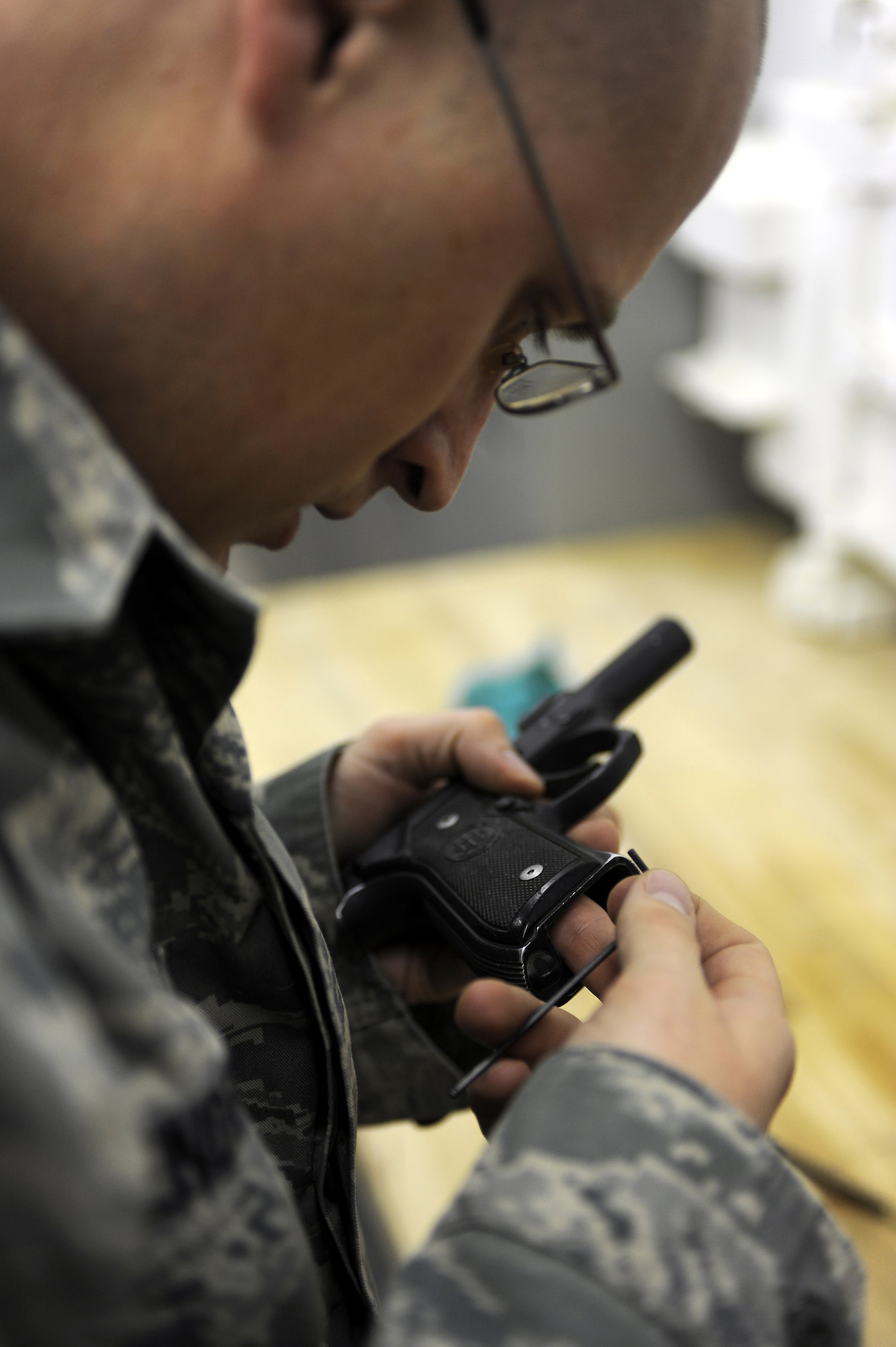 Senior Airman Miguel Romero prepares his 9 mm rounds up for inspection during his ammo turn-in prior to redeploying Jan. 22, 2011, at Kandahar Airfield, Afghanistan. The 451st Expeditionary Security Forces Squadron Combat Arms section is responsible for the inventory of nearly 175,000 9 mm rounds for the M9 pistol, and more than 940,000 of the 5.56 mm rounds for the M16 rifle. Airman Romero is an HH-60G Pave Hawk maintenance analysis journeyman assigned to the 55th Expeditionary Helicopter Maintenance Unit. (U.S. Air Force photo/Senior Airman Willard E. Grande II/Released)