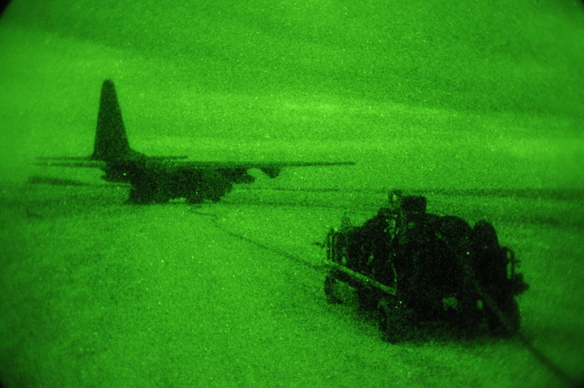 IE SHIMA AIRFIELD, Japan -- Staff Sgt. Jason Lemke, monitors gauges on a forward area manifold cart connected to a MC-130H Combat Talon II during a refueling mission at a forward area refueling point here Jan. 20 as part of Beverly High 11-02, a local operational readiness exercise. FARP specialists and loadmasters utilized the cart to transfer fuel from the MC-130H to a U.S. Marine Corps CH-46E Sea Knight helicopter. FARP areas are used to transfer fuel from one aircraft to another in hostile and austere environments. Members of the 353rd SOG are participating in the exercise to hone their warfighting skills in preparation for a headquarters inspection next month.  (U.S. Air Force photo by Tech. Sgt. Aaron Cram)